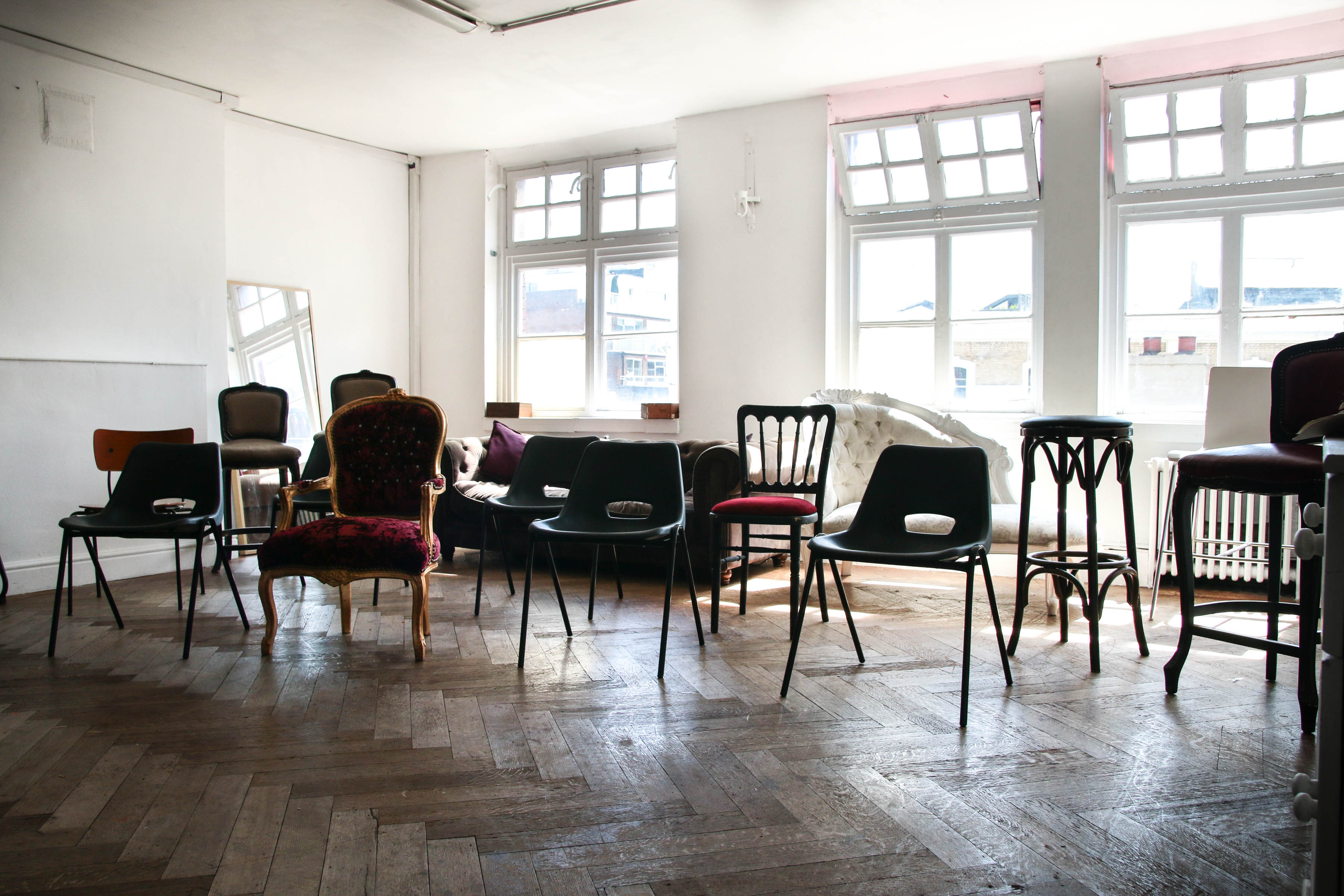 Versatile event space with natural light, ideal for workshops and gatherings at The Factory Studio.