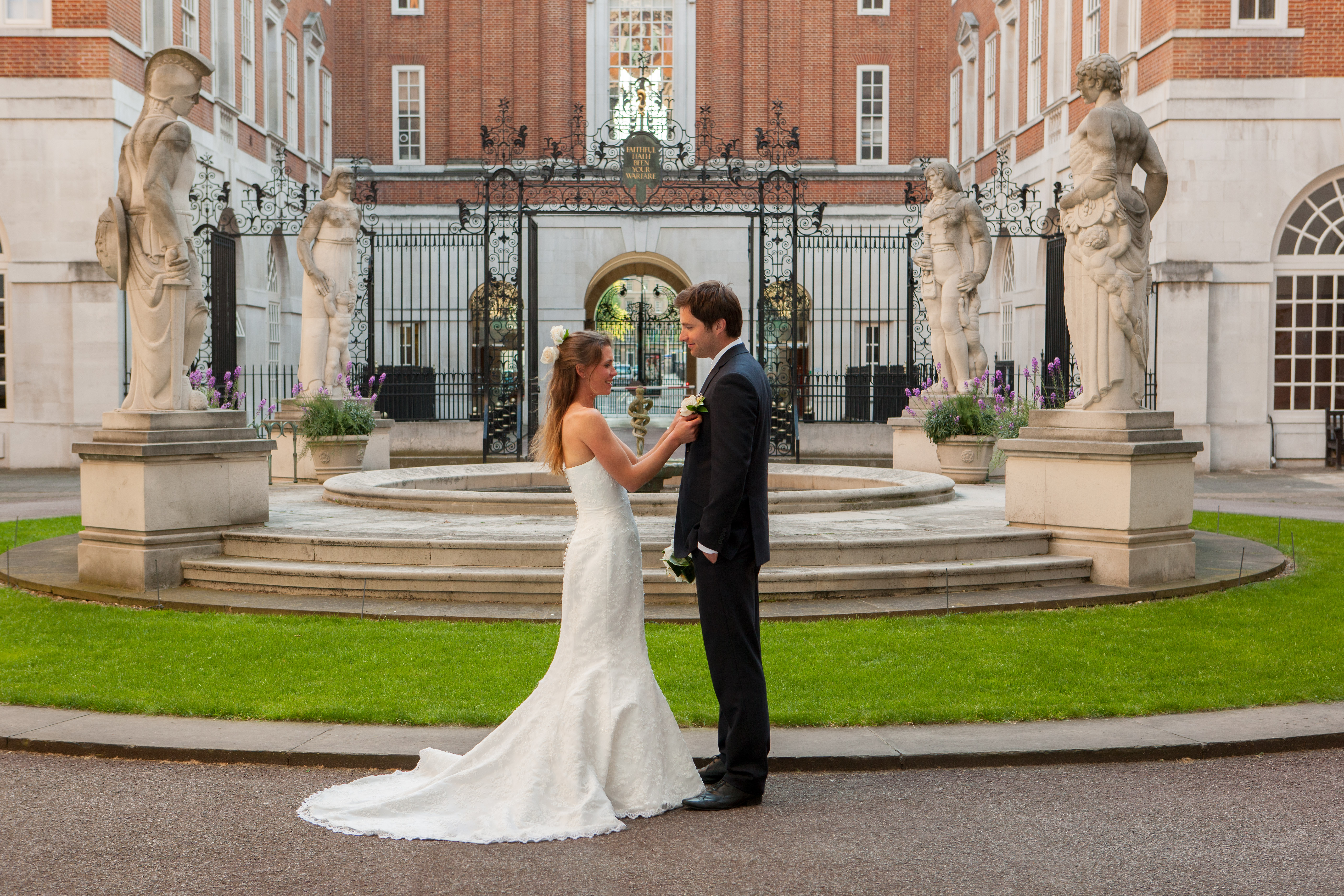 Elegant outdoor wedding at BMA House courtyard with fountain and classic architecture.