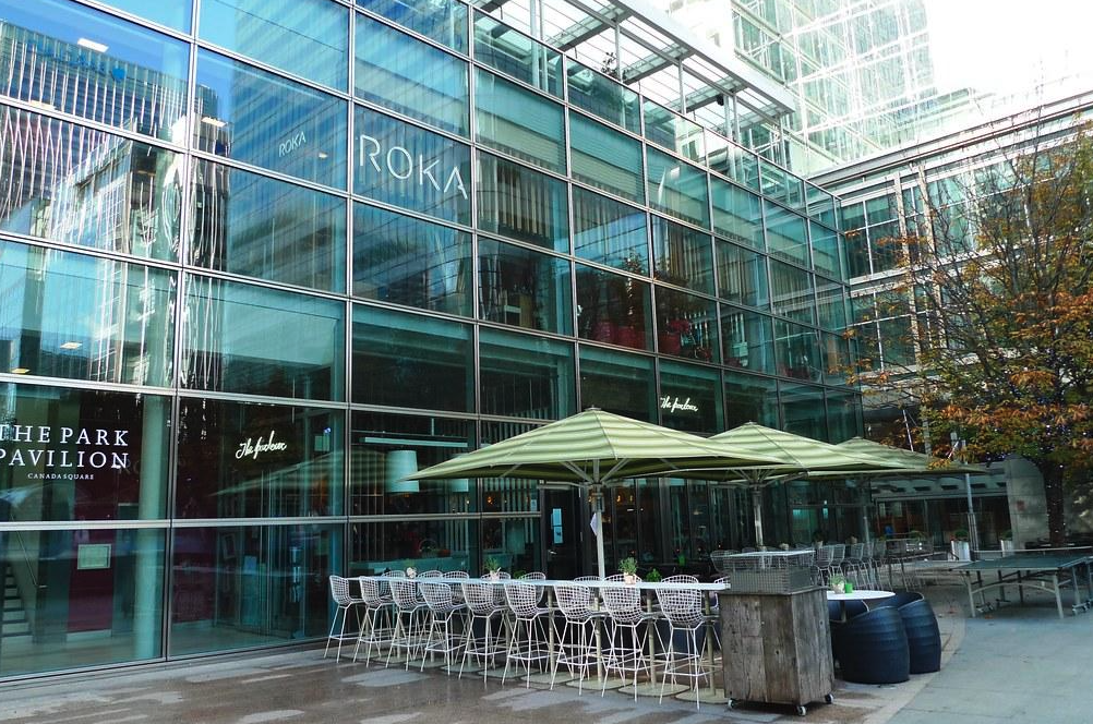 Modern venue with glass facade, ideal for corporate meetings and upscale events.