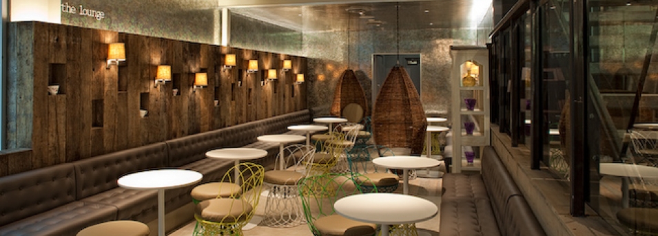 Stylish event space in The Parlour with warm lighting for networking and gatherings.