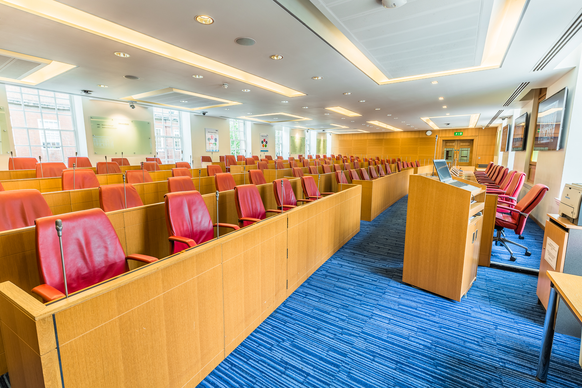 Council Chamber in BMA House with red leather chairs, ideal for meetings and presentations.