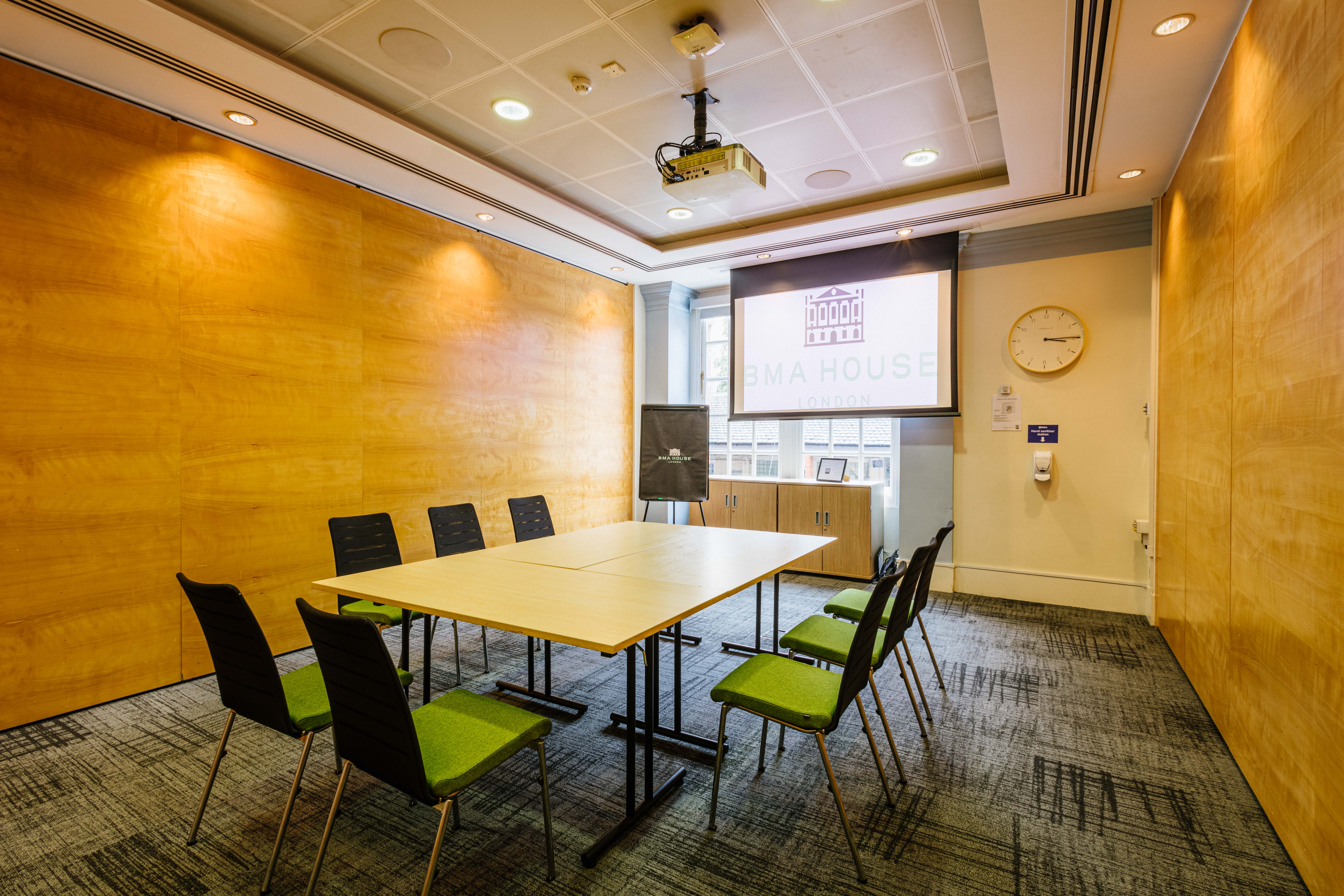 Modern meeting room in BMA House with large table, ideal for collaborative events.