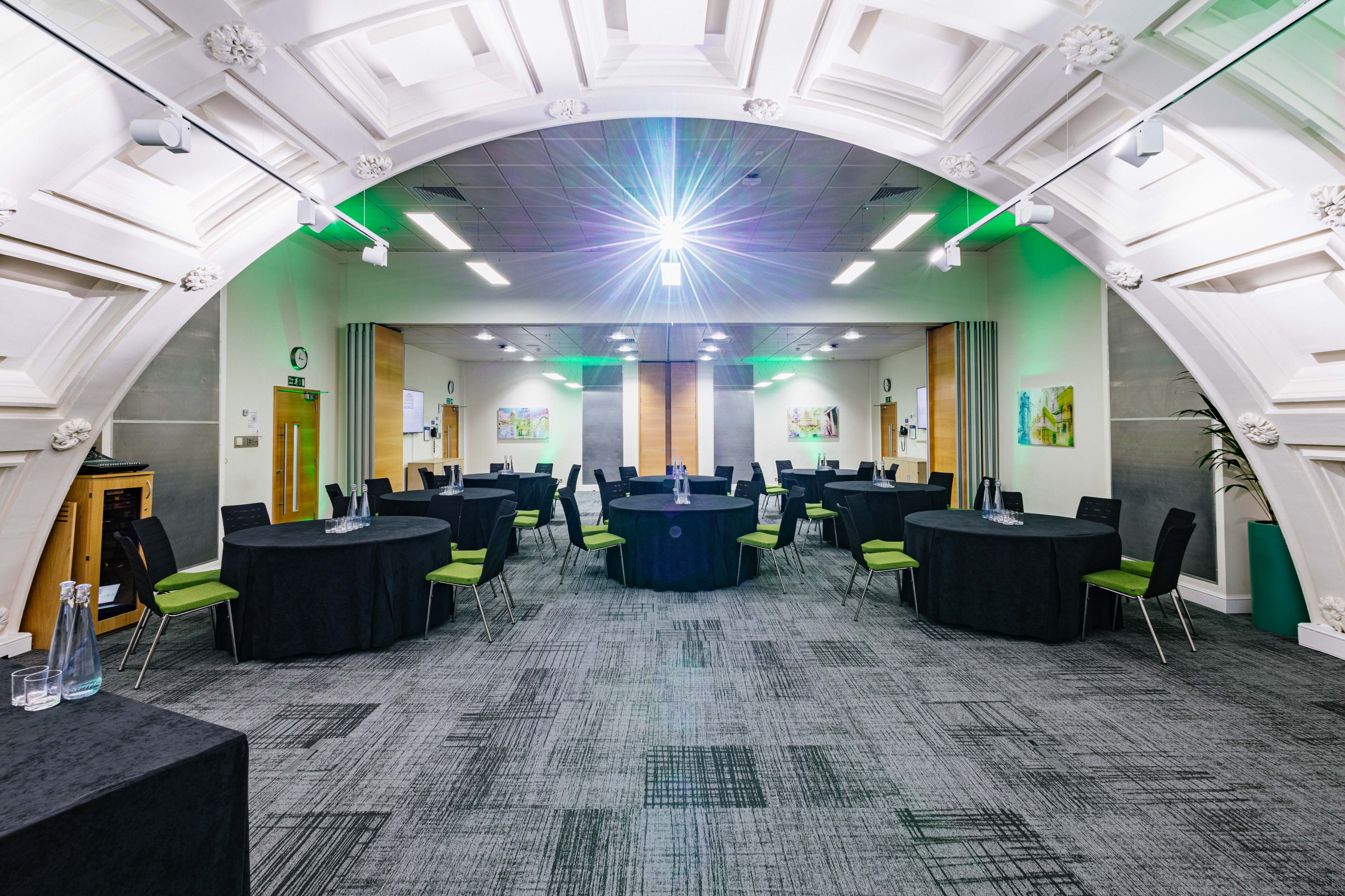 Bevan Suite at BMA House: modern event space with round tables, ideal for conferences.
