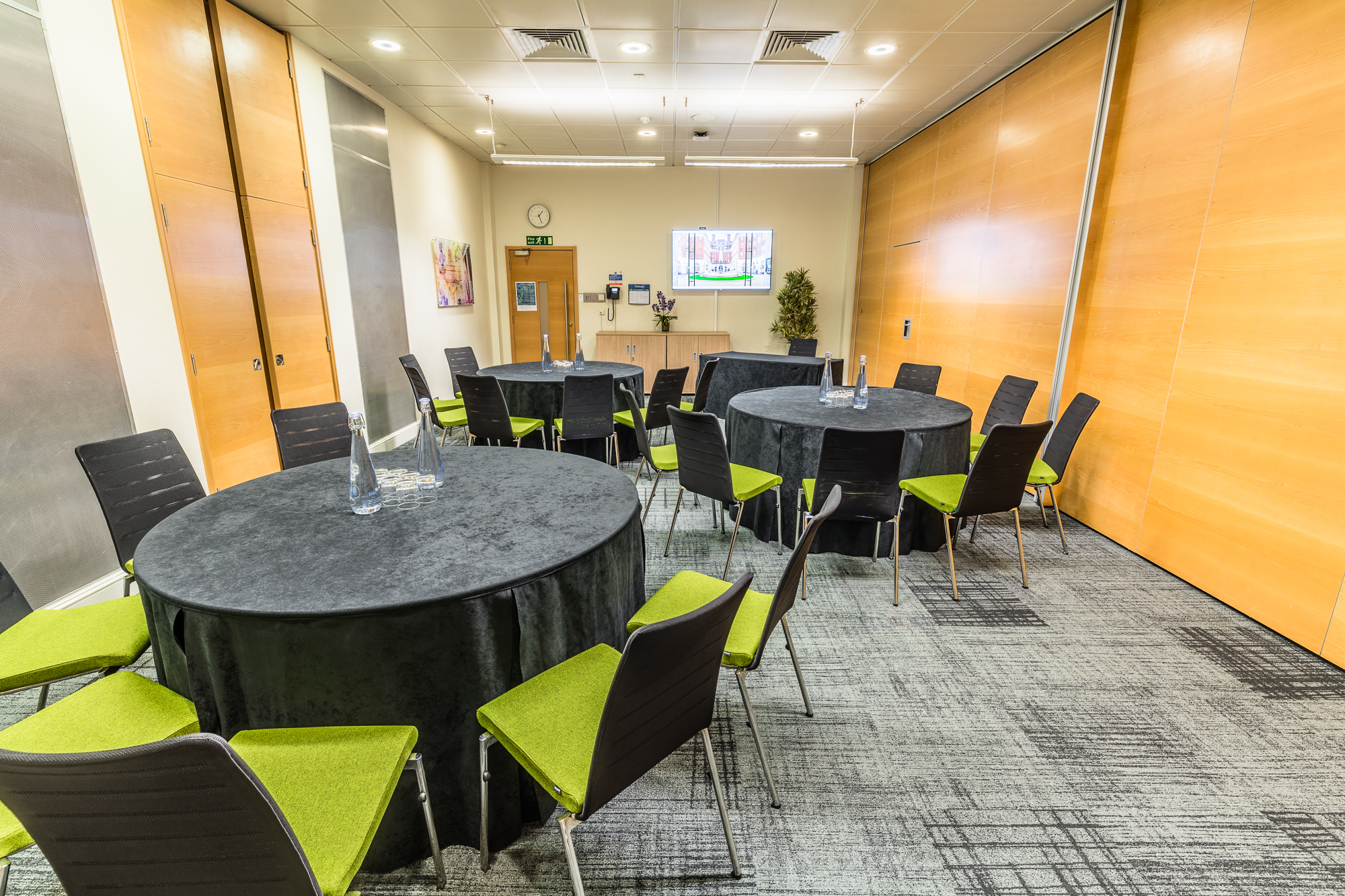 Lister Fleming Suite in BMA House: modern meeting room with round tables, ideal for workshops.