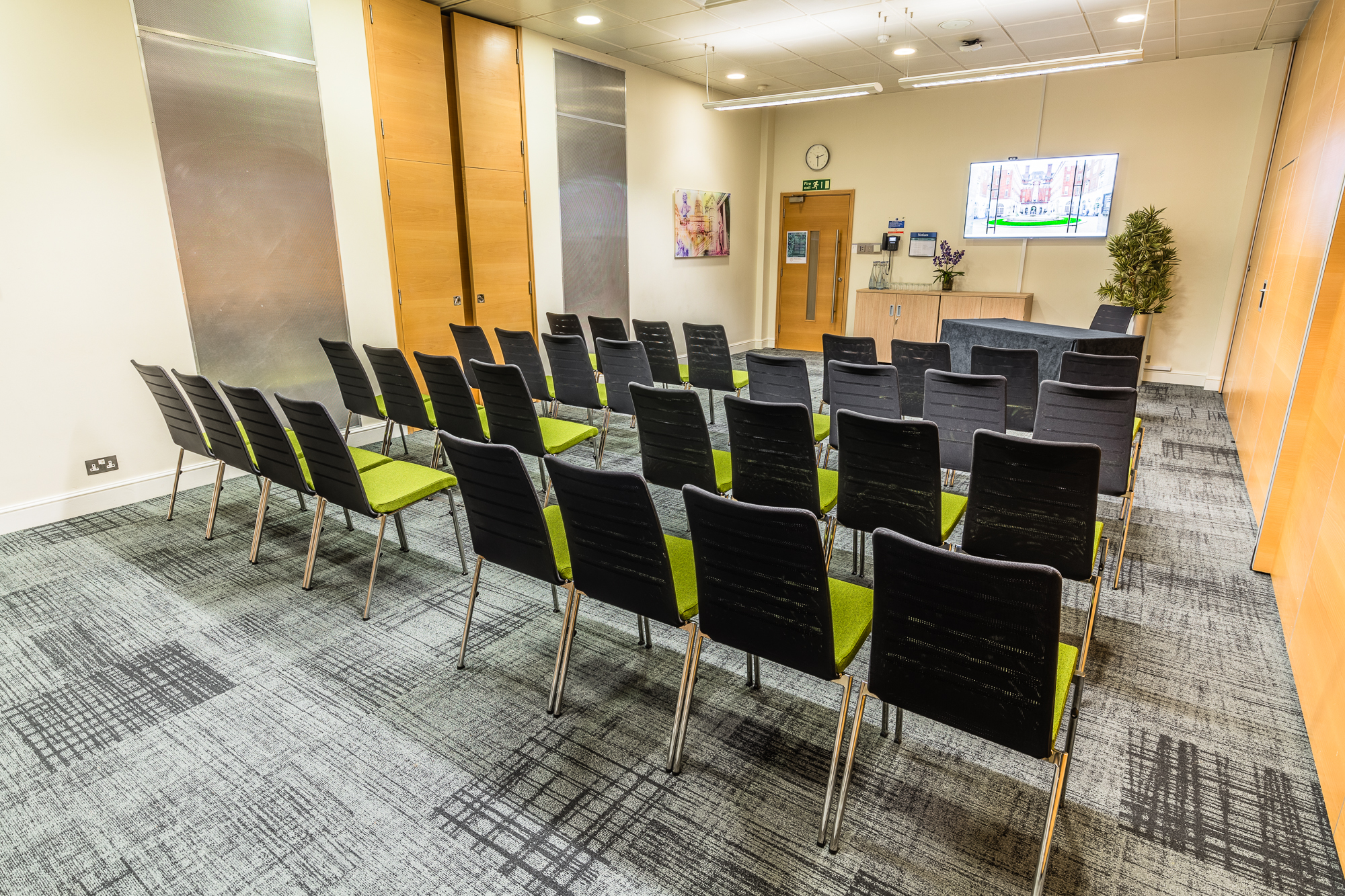 Lister Fleming Suite in BMA House, modern meeting room with black chairs for workshops.