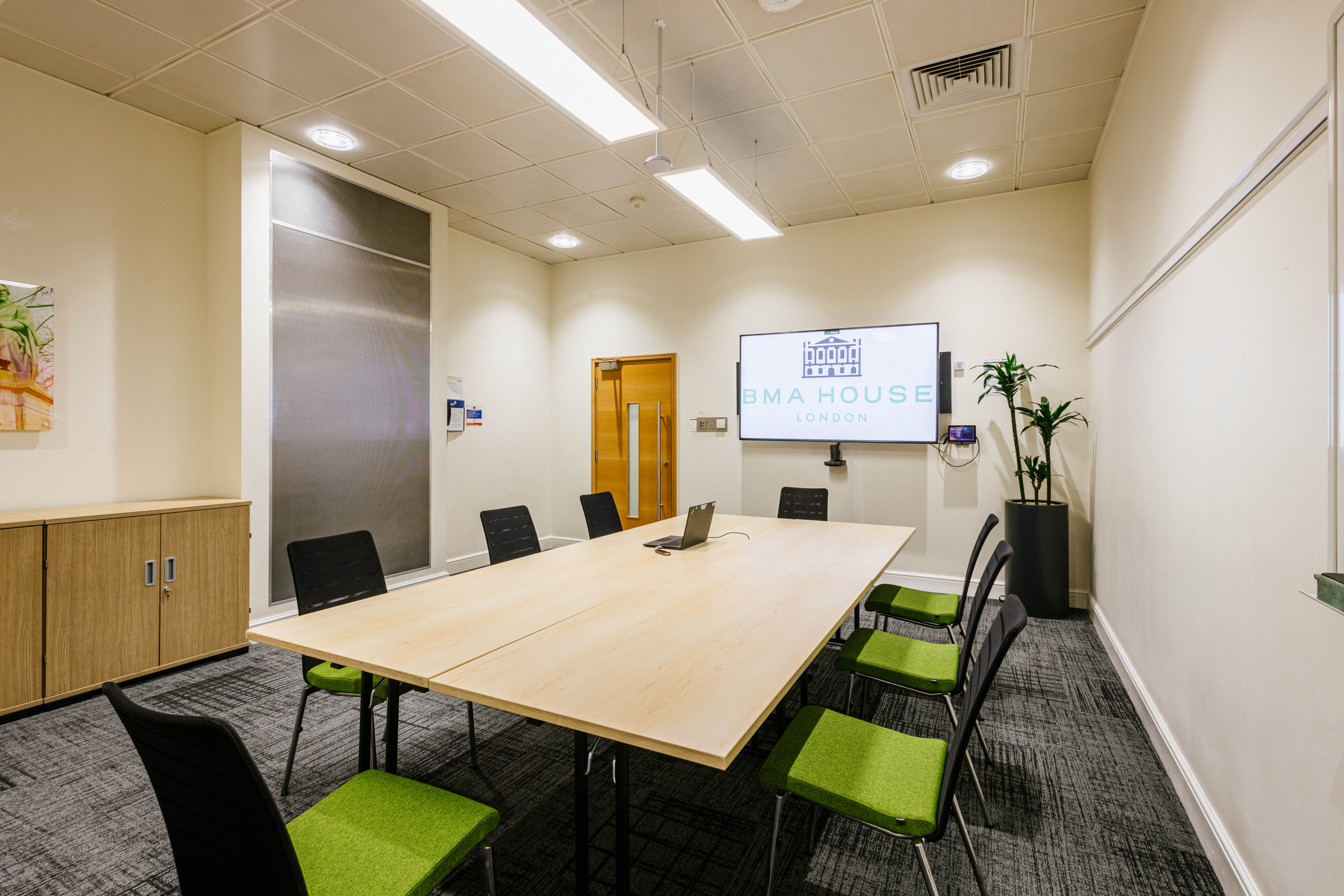 Modern meeting room in BMA House with large table, ideal for collaborative events.