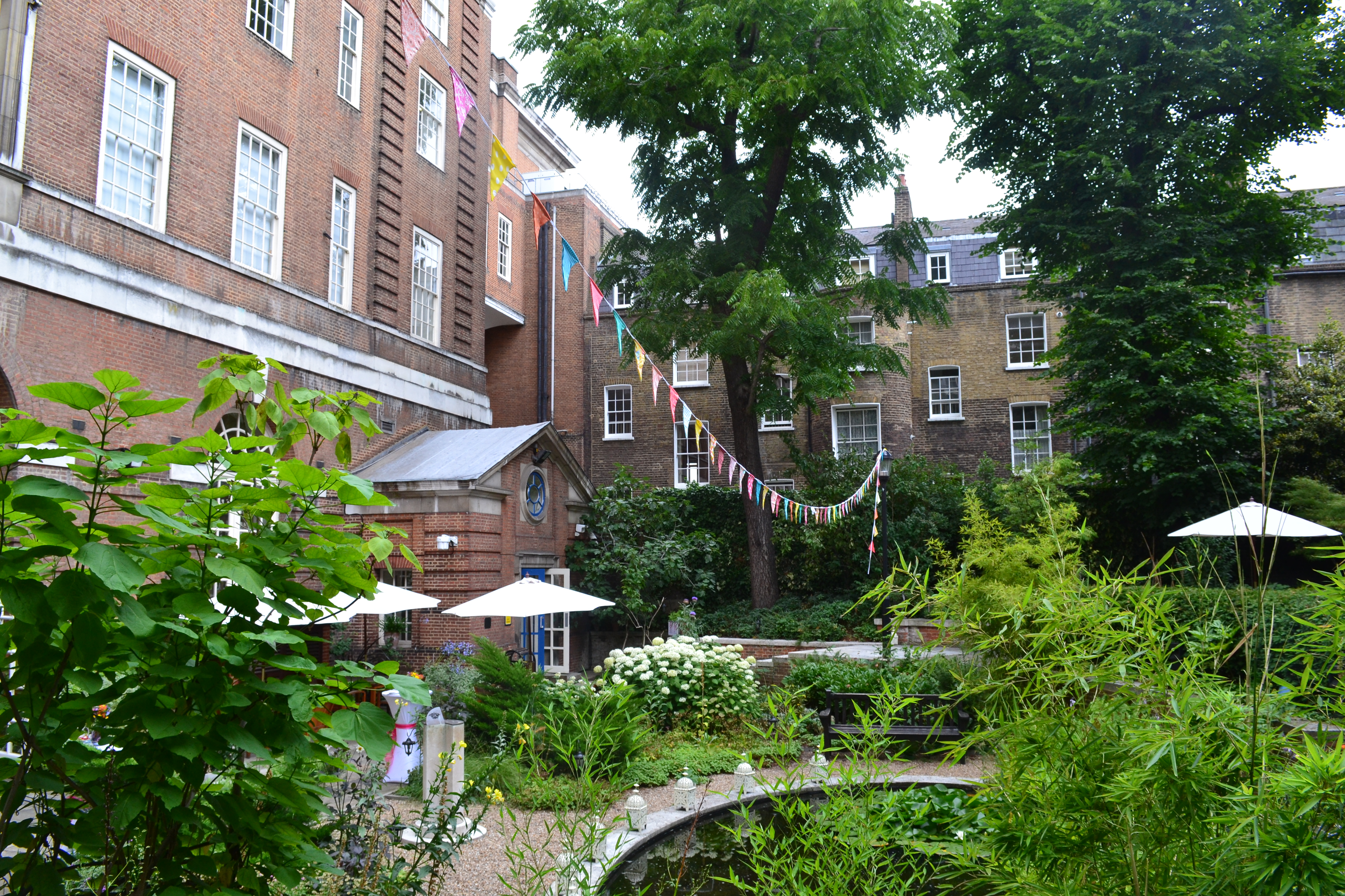 Charming outdoor venue with lush greenery for garden parties and receptions at BMA House.