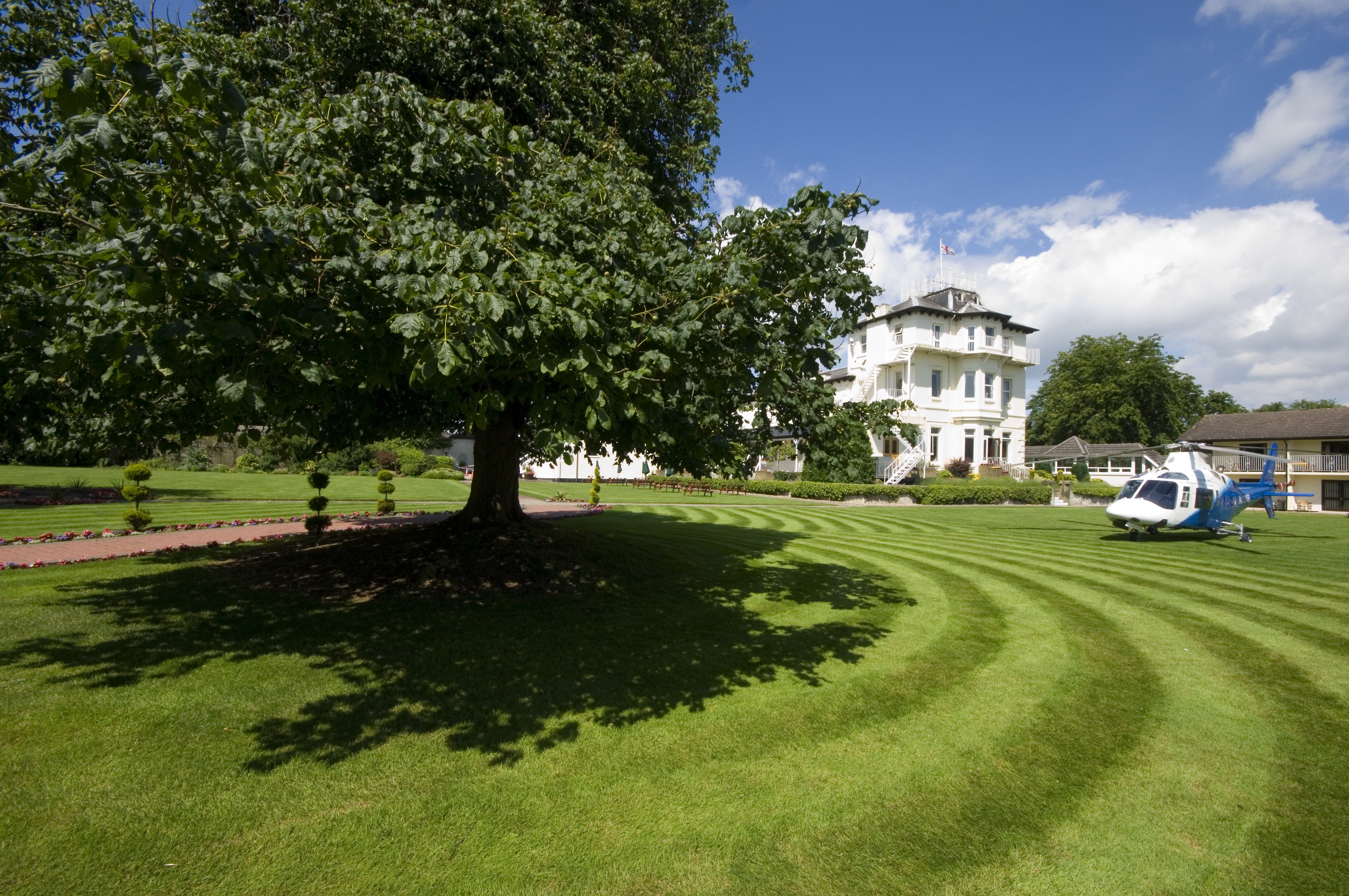 Torintone Suite at Thornton Hall, elegant venue for outdoor corporate events with manicured lawns.