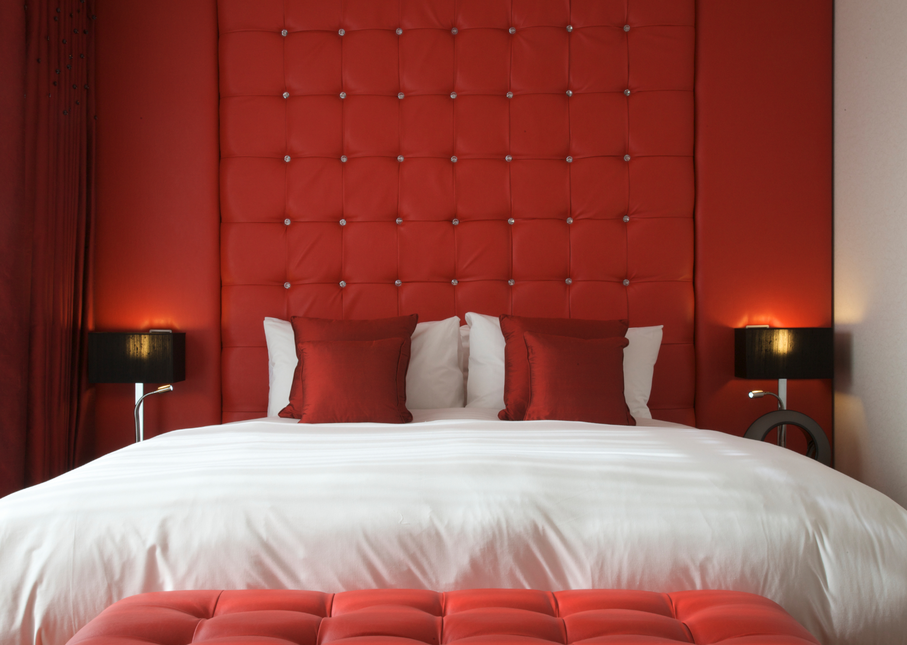 Ruby Loft Suite at The Bermondsey Square Hotel, vibrant decor for meetings and relaxation.