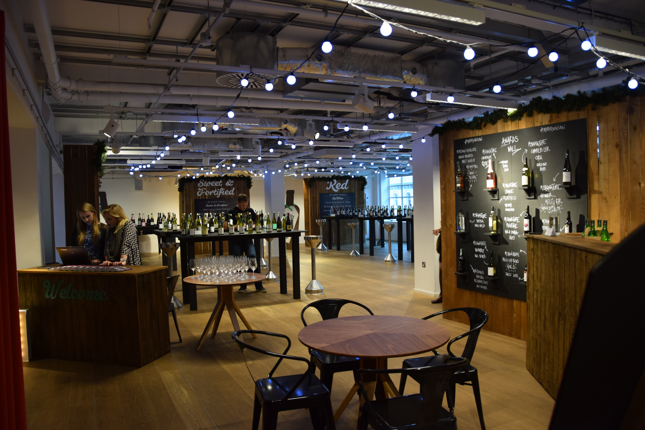 Stylish auditorium venue with modern bar, ideal for networking and cocktail receptions.