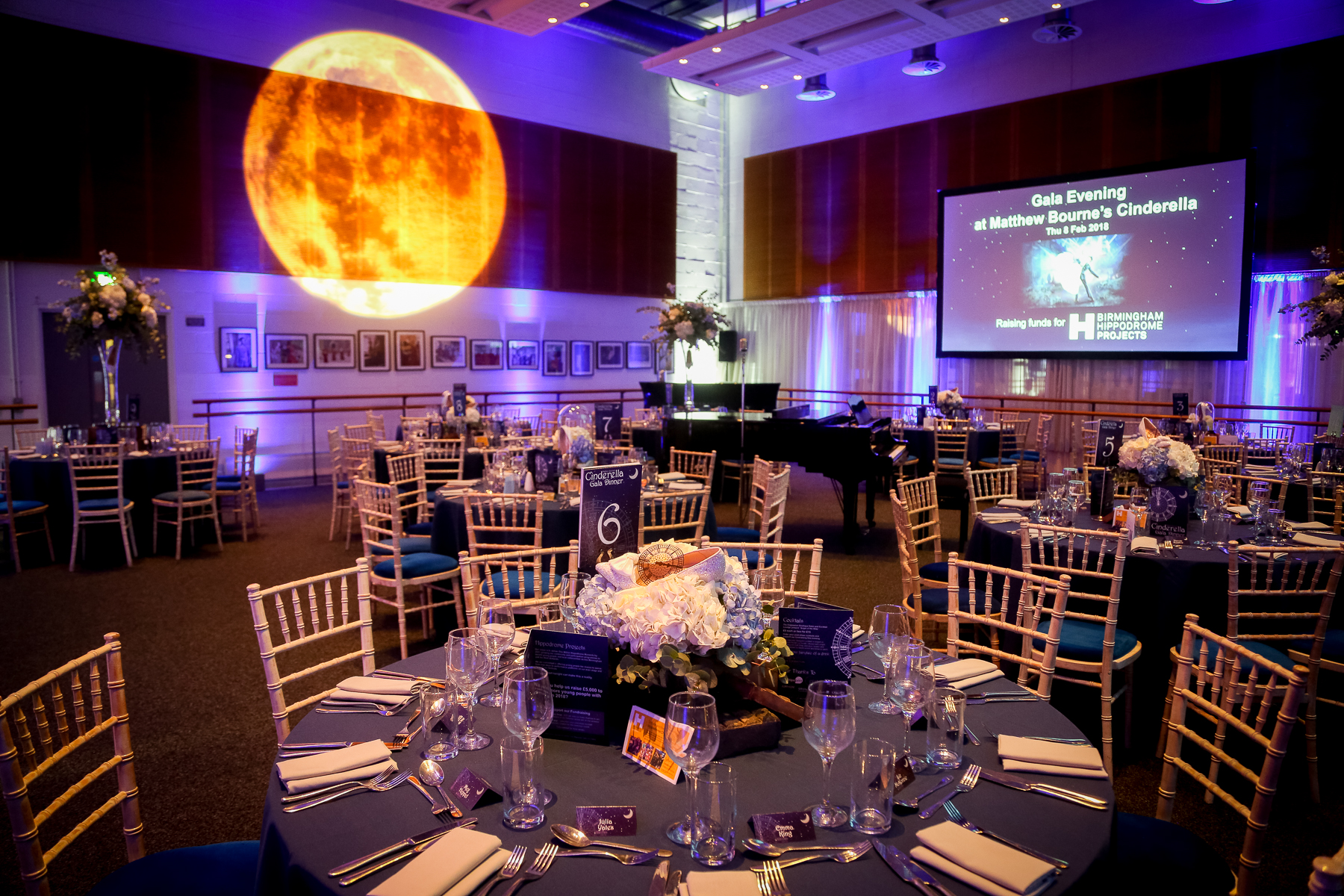 Elegant event setup in Birmingham Hippodrome's Studio 5 with navy linens and moon projection.