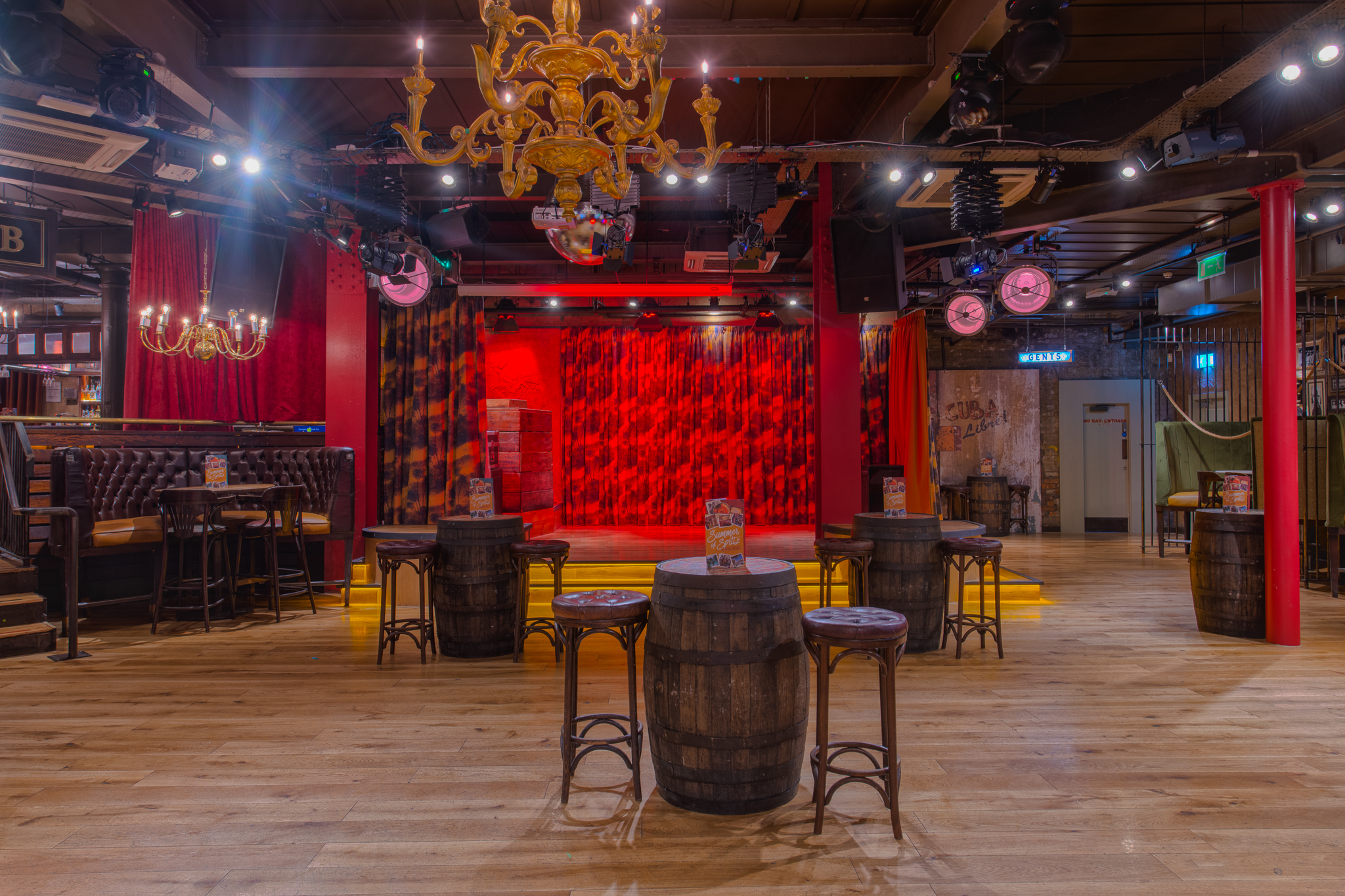 Havana Rooms event space with vibrant stage, ideal for corporate and social gatherings.