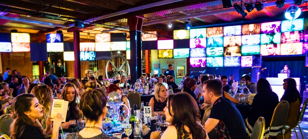 Revolution Manchester Gallery event space with elegantly dressed attendees networking.