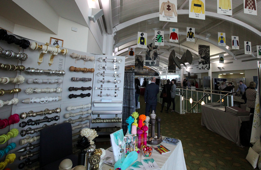 Hall of Fame exhibition at Cheltenham Racecourse, vibrant vendor displays and networking event.