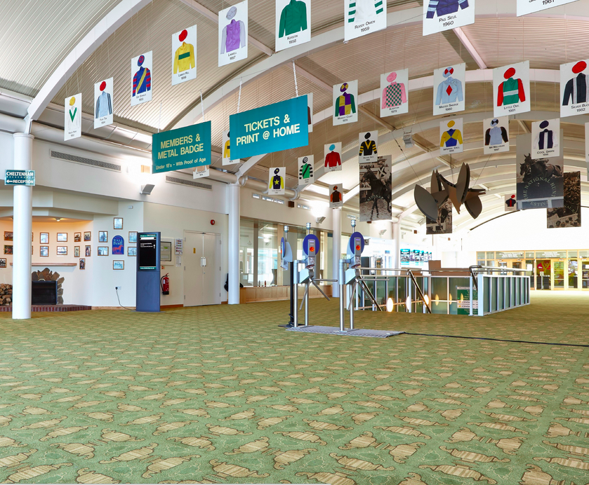 Hall of Fame at Cheltenham Racecourse, spacious venue with vibrant decor for events.
