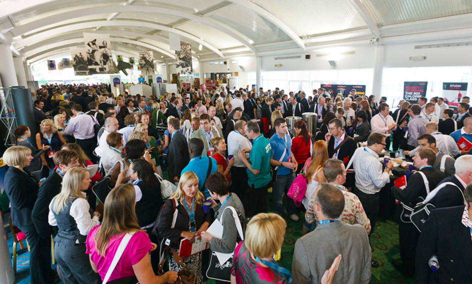 Hall of Fame at Cheltenham Racecourse, vibrant networking event with diverse attendees.