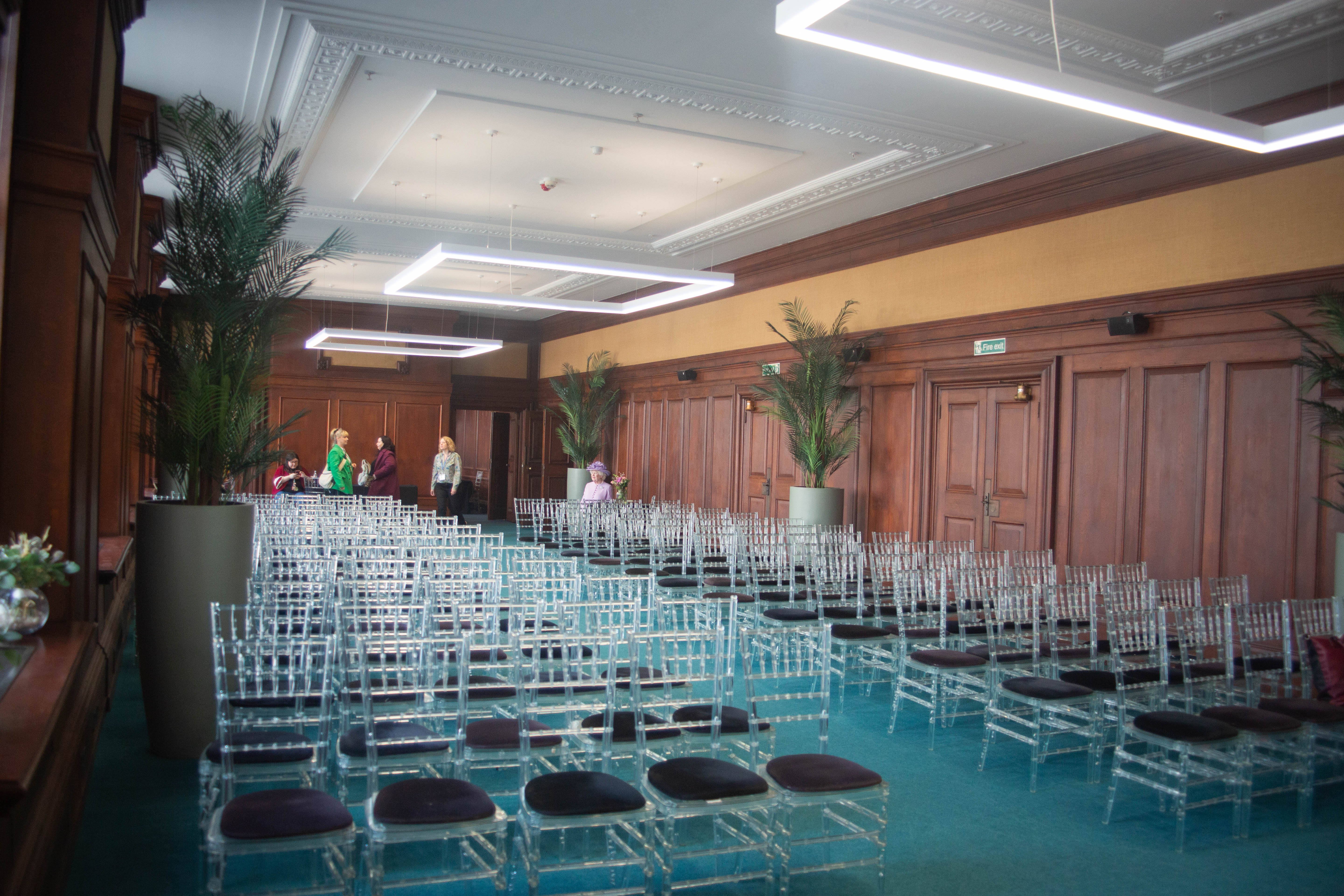 Riverside event space, elegant seating, modern ceremony