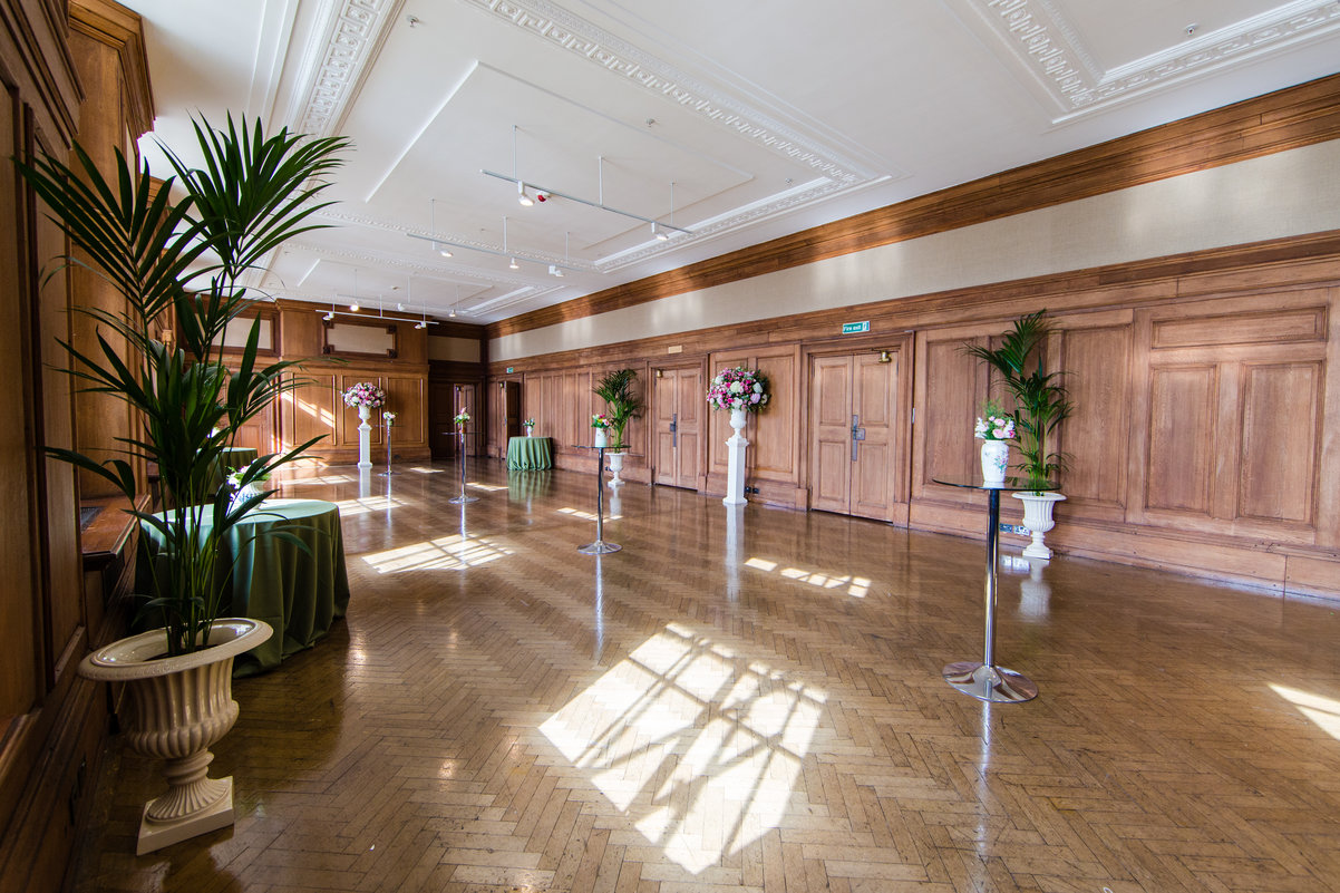 Spacious Riverside Rooms event space with polished floors, perfect for meetings and receptions.