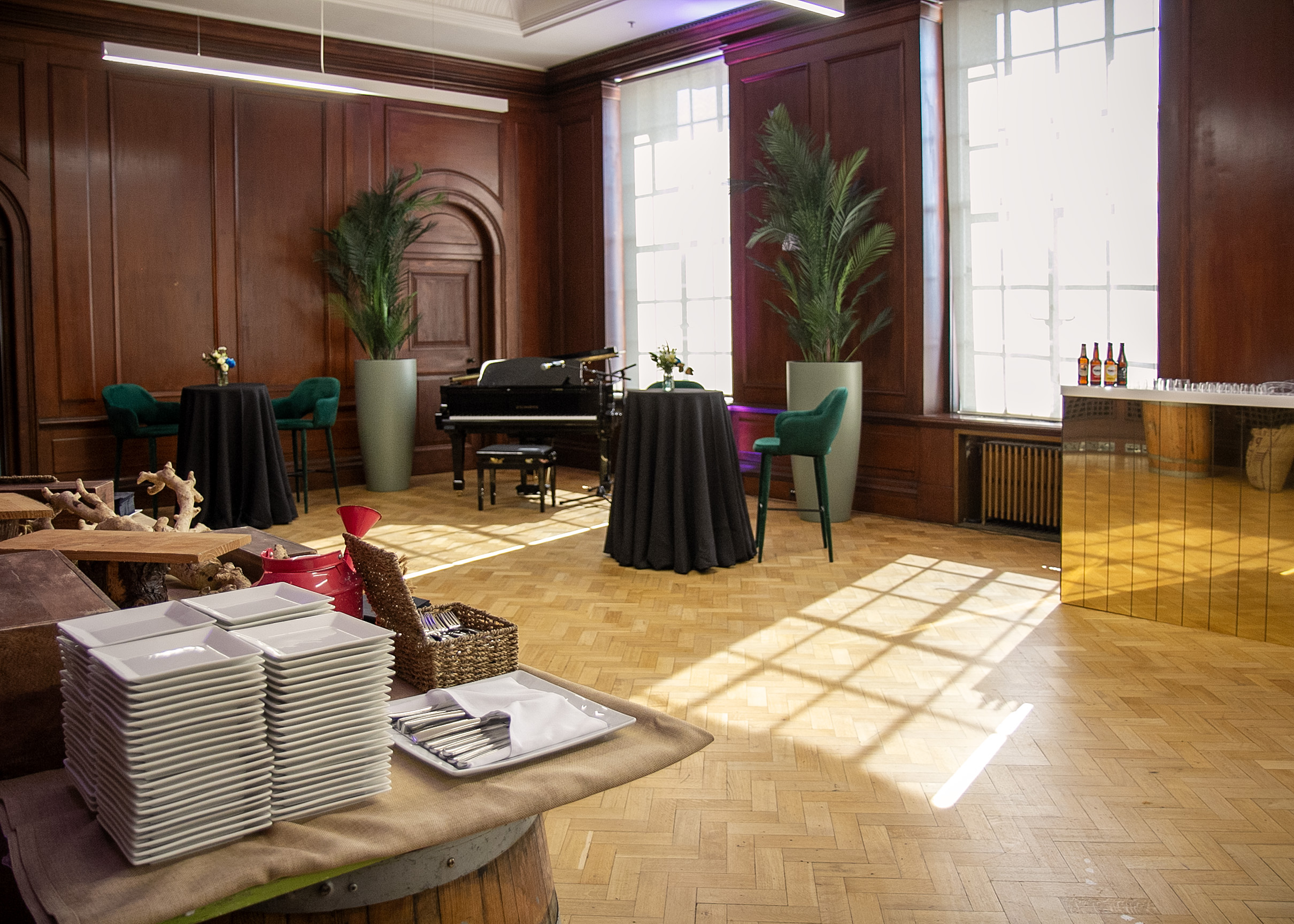 Elegant Riverside Rooms event space with wooden paneling, ideal for upscale gatherings.