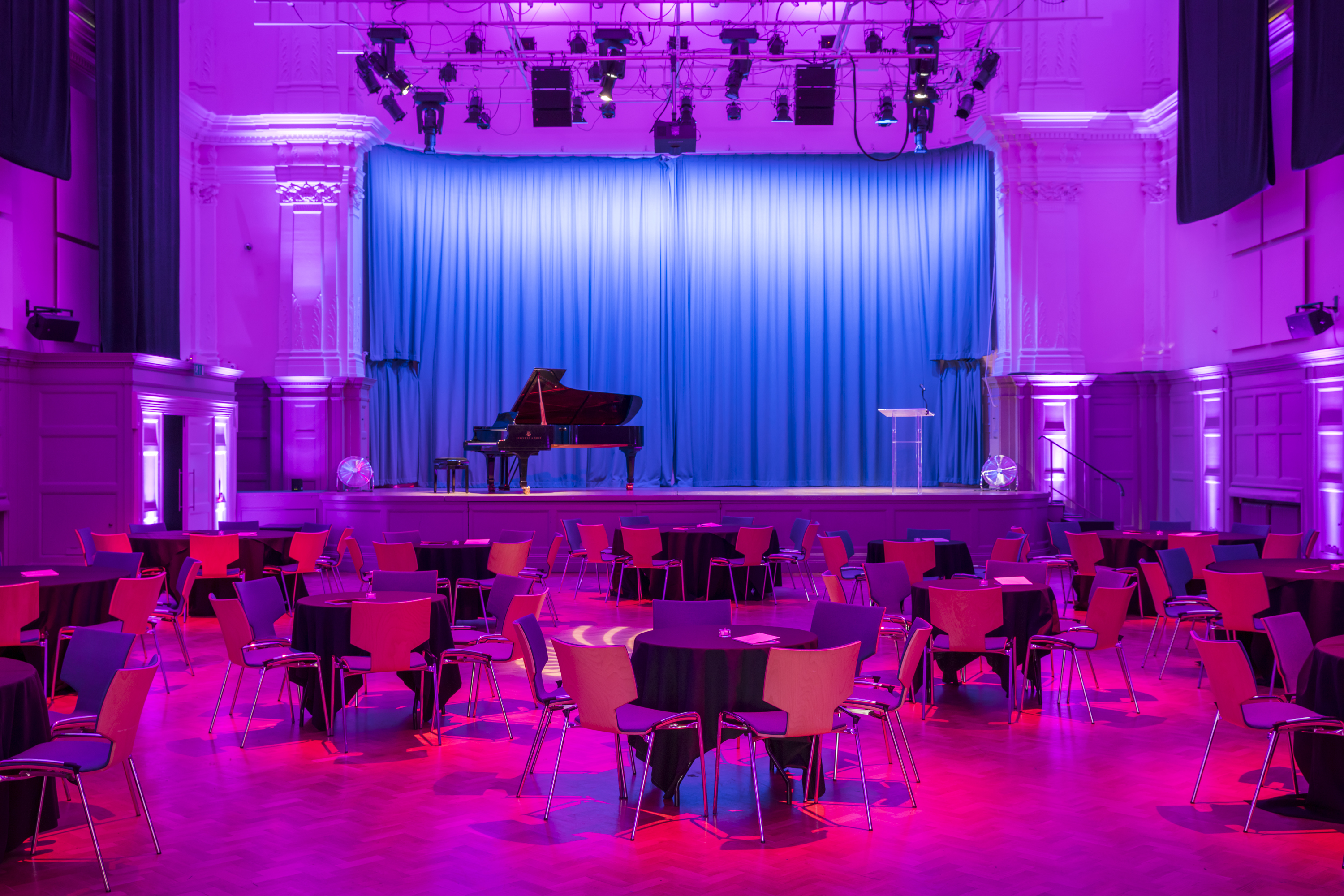 Great Hall at Bishopsgate Institute with stage, ideal for events and performances.