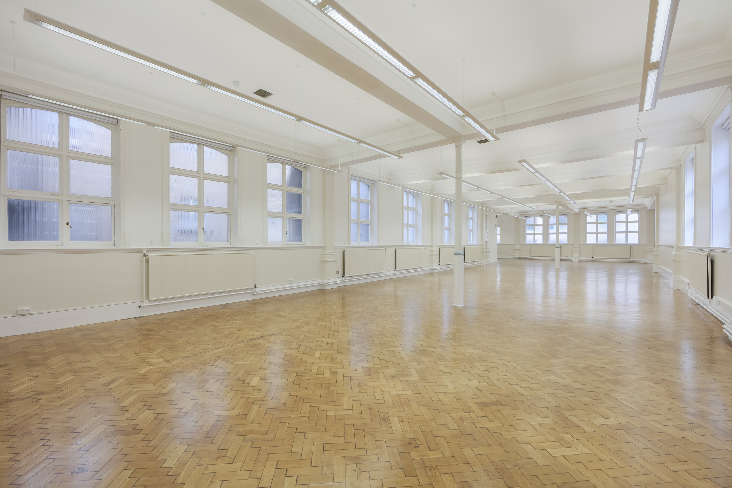 Spacious Upper Hall at Bishopsgate Institute, perfect for workshops and seminars.