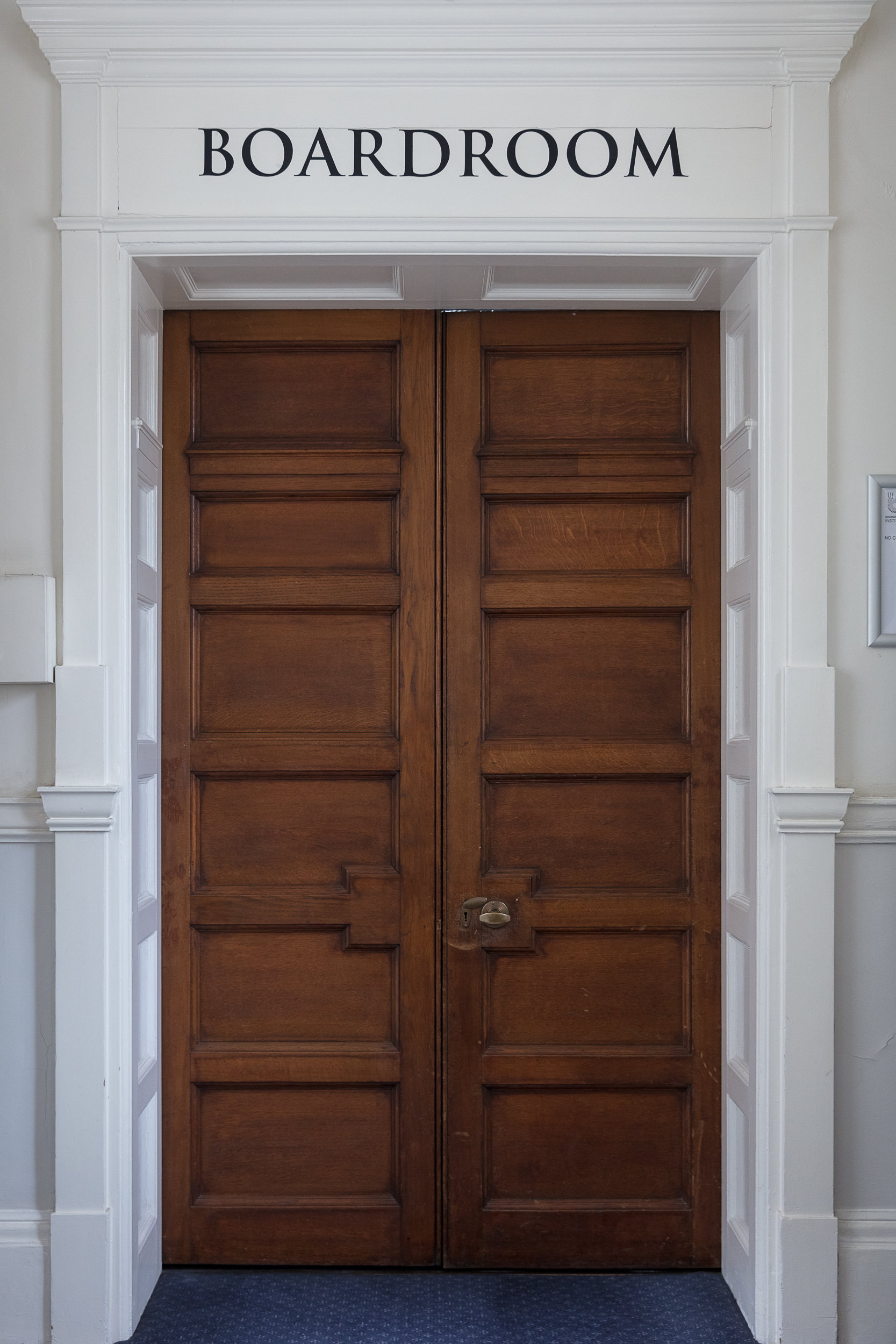 Elegant wooden double doors at Bishopsgate Institute for professional meetings and events.
