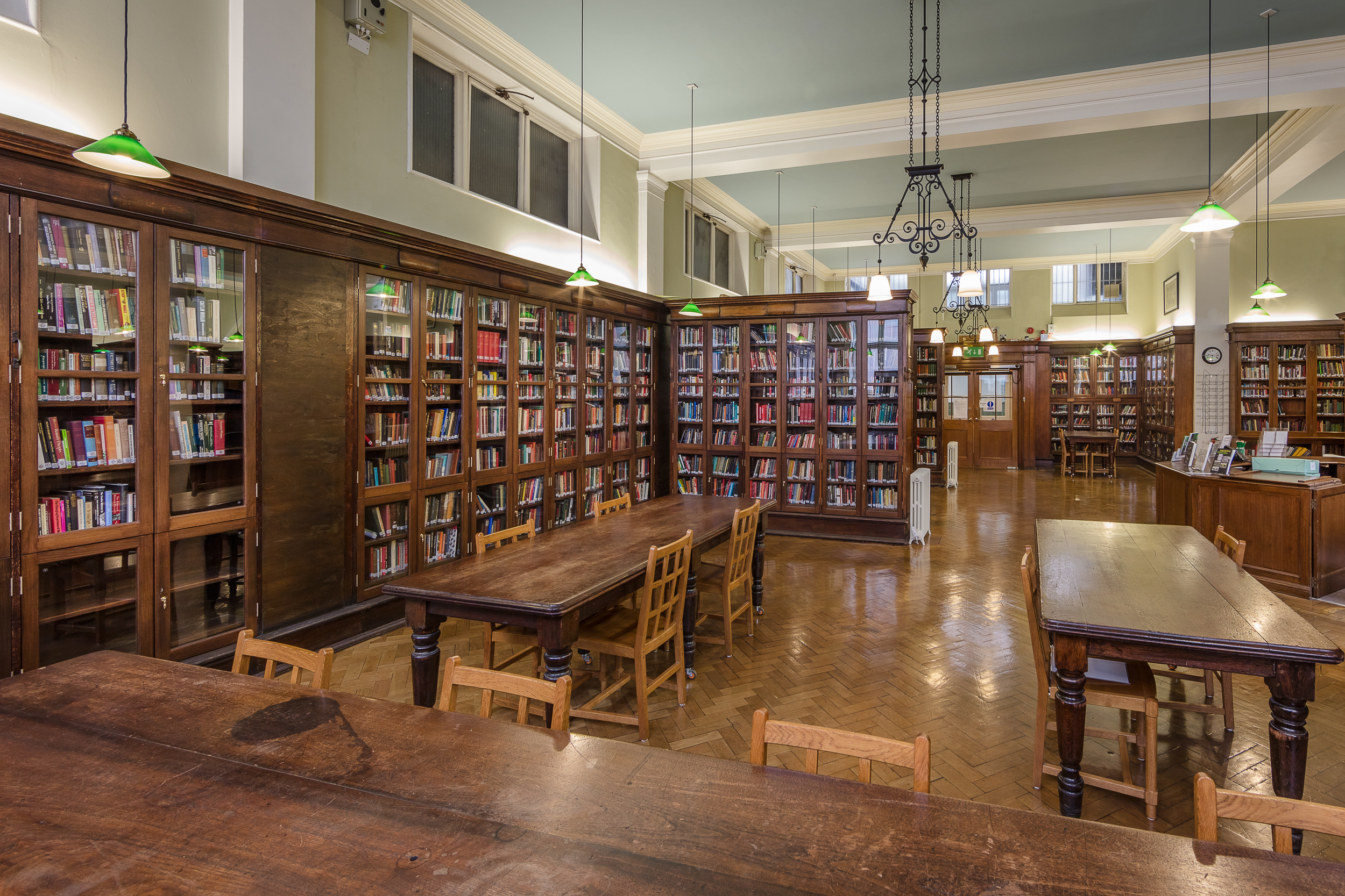 Victorian Library at Bishopsgate Institute, cozy wooden bookshelves for events and workshops.