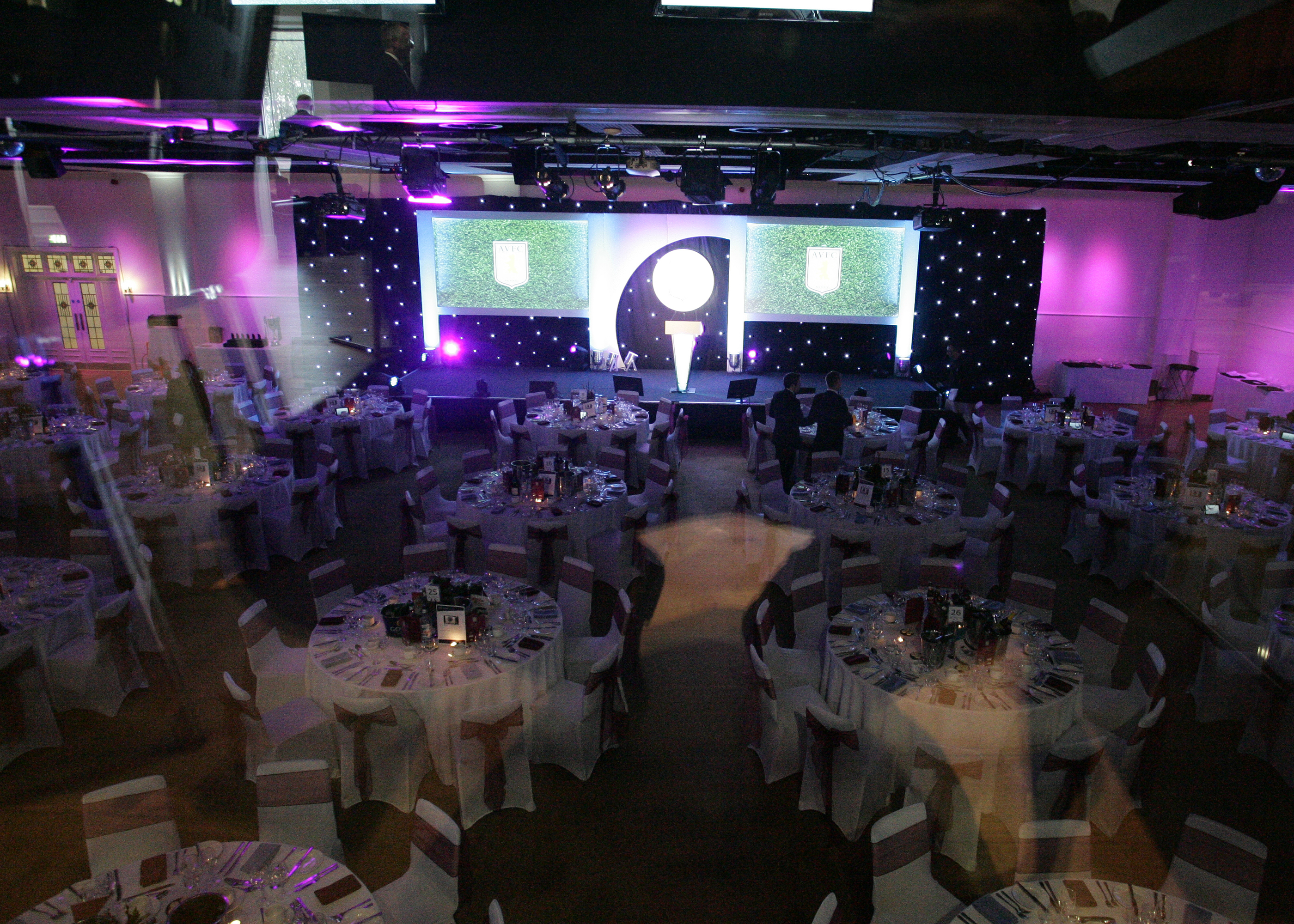 Elegant event space at Villa Park with round tables, perfect for conferences and gala dinners.
