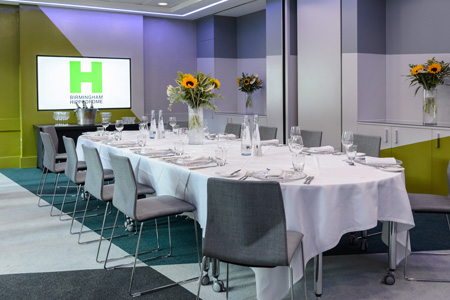 Gowling WLG Suite with long table and floral decor, ideal for conferences and workshops.
