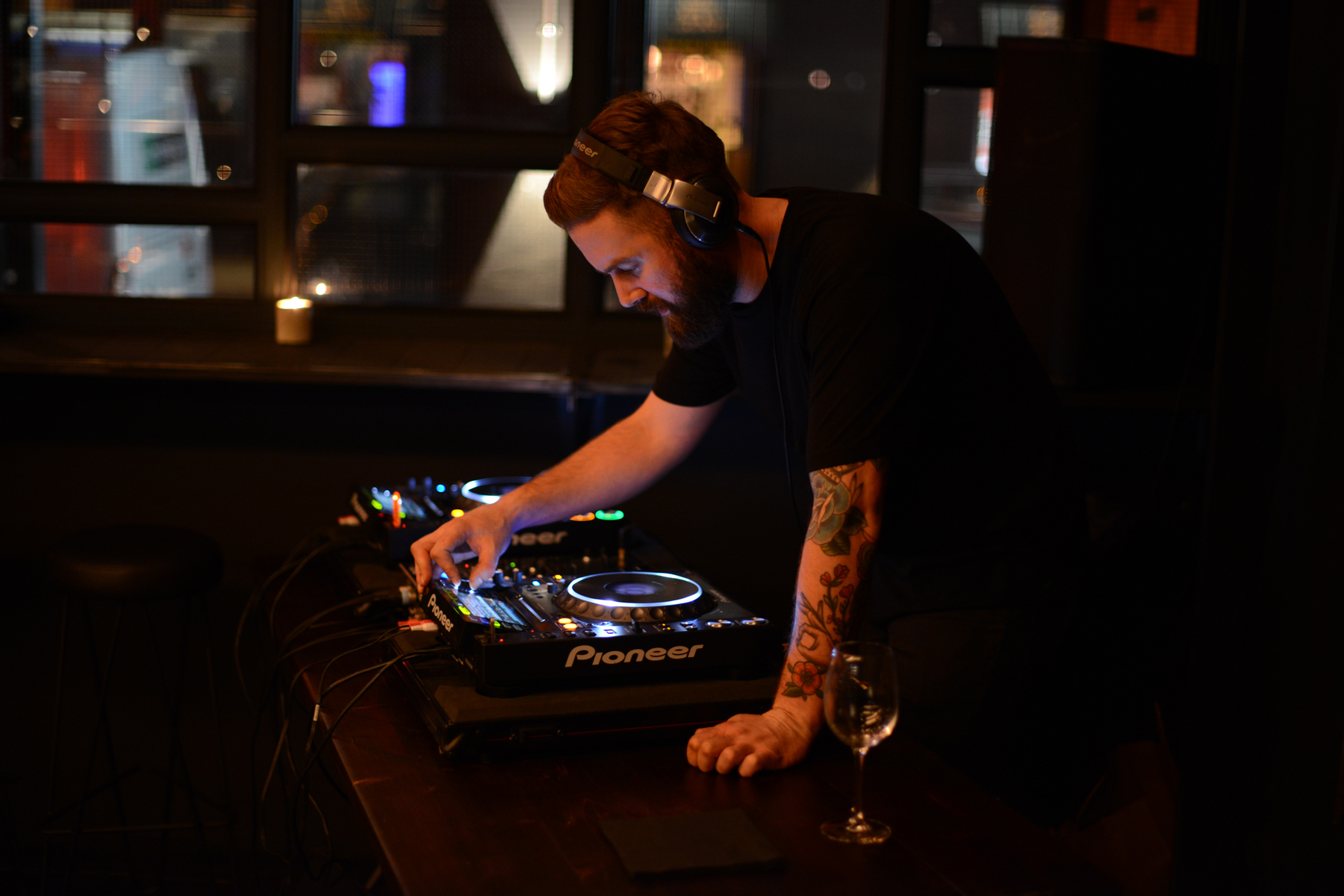 DJ mixing tracks at HotBox Spitalfields, a stylish venue for upscale events.