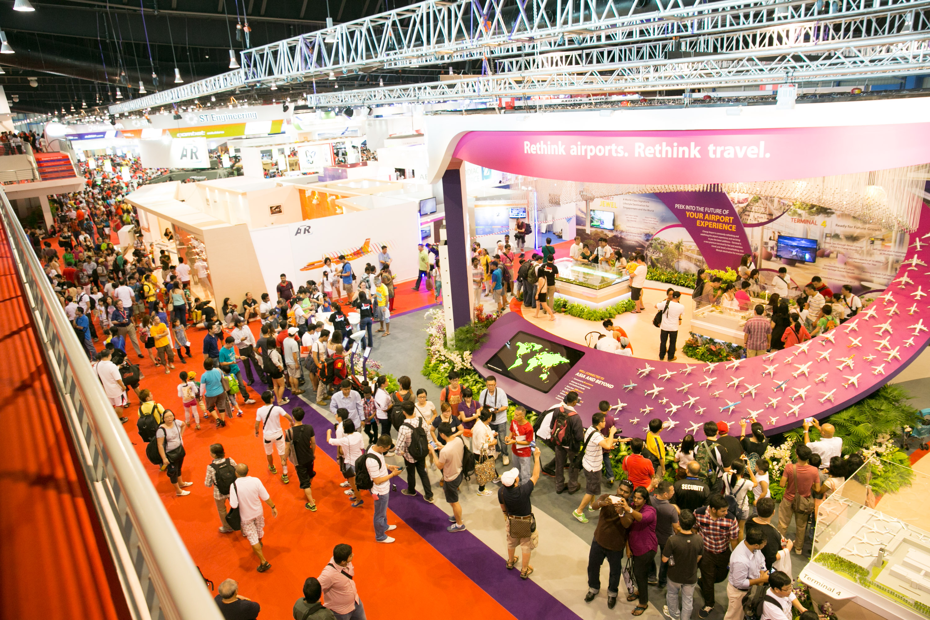 Changi Exhibition Centre trade show with vibrant booths and engaged attendees.