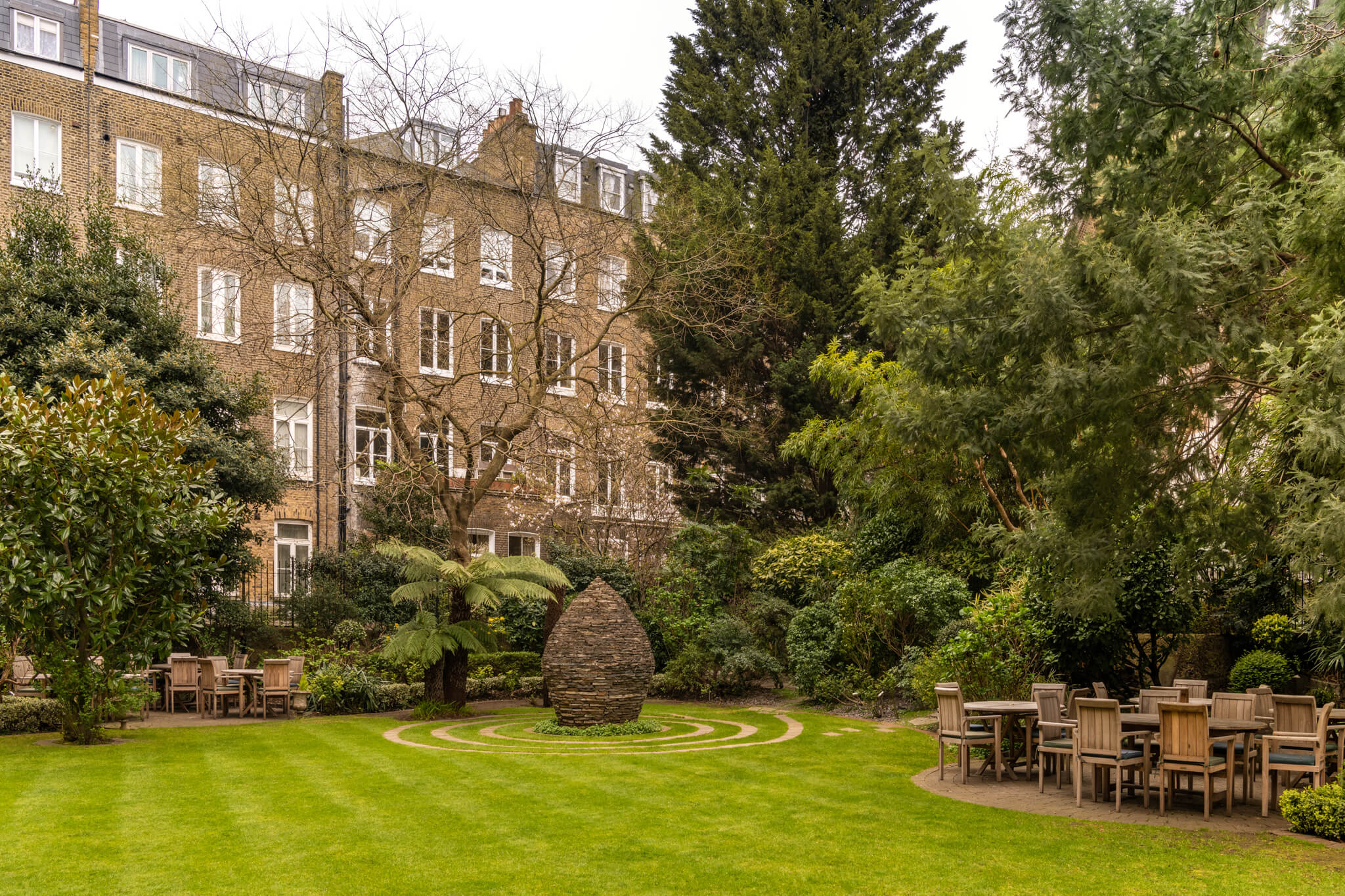 Serene garden venue at K+K Hotel George, ideal for corporate retreats and networking events.