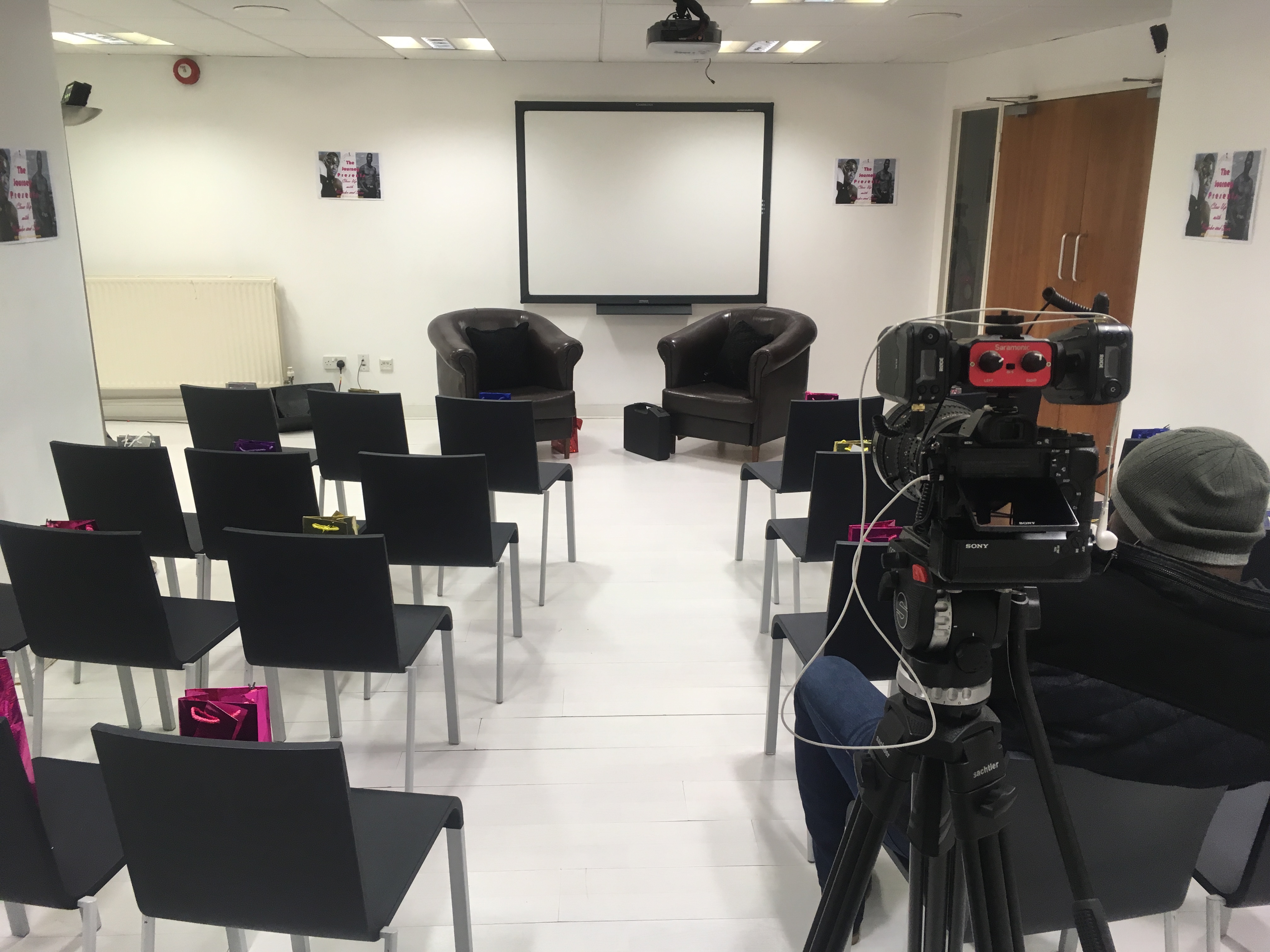 "Eastside Shoreditch studio with leather armchairs for panel discussion setup"