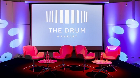 Modern pink chairs in The Grand Hall, Wembley for engaging event discussions.