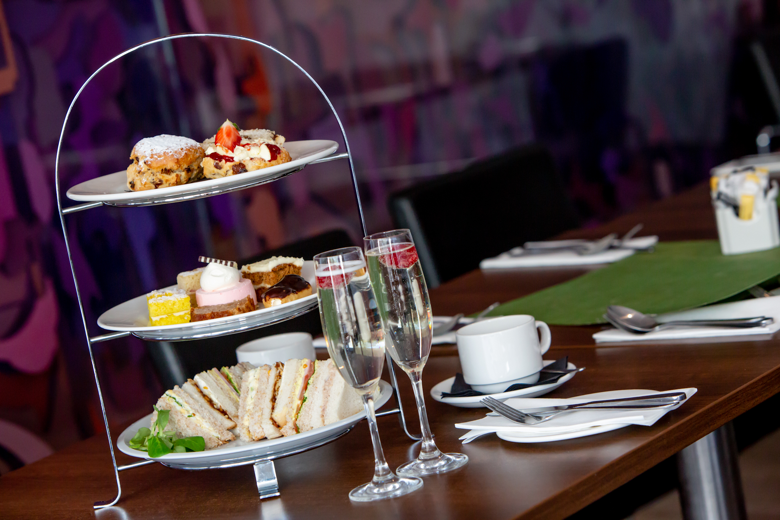 "Tiered pastries and sandwiches at Exchange Restaurant, ideal for afternoon tea events."