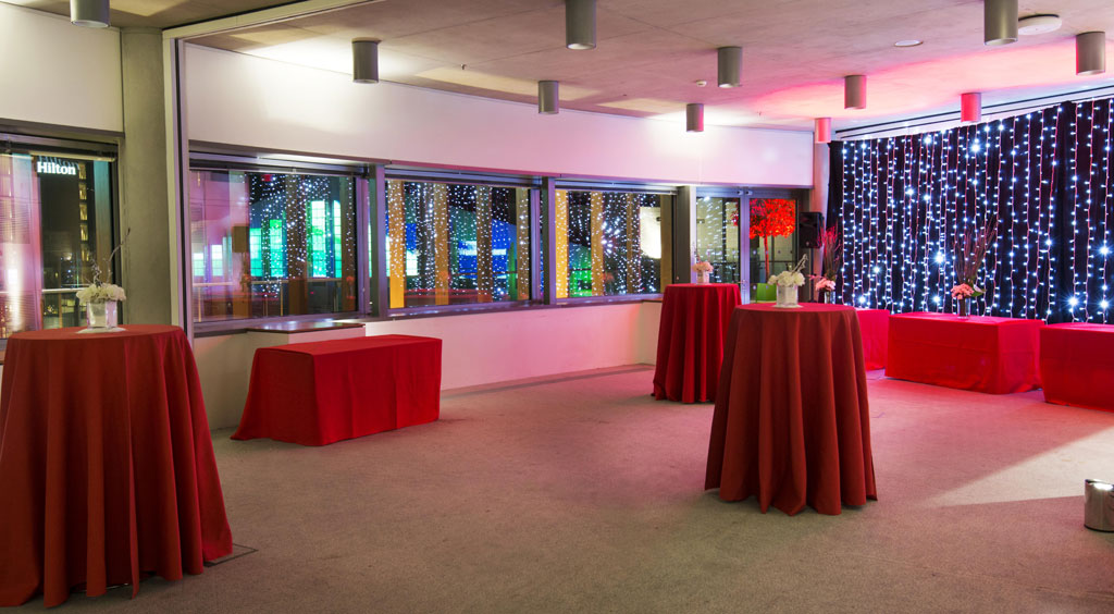 Stylish Terrace Rooms at Wembley with red tablecloths, ideal for networking events.