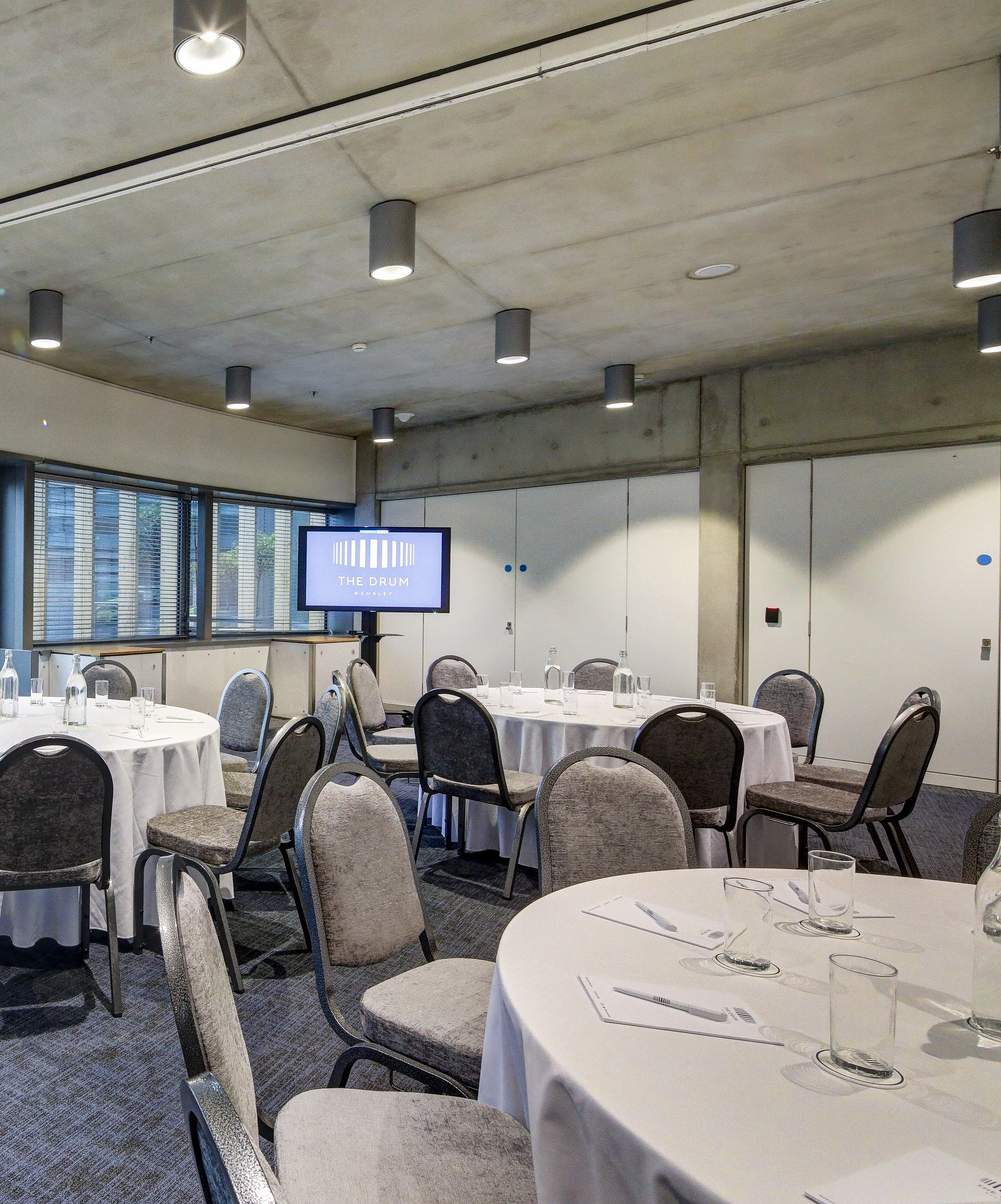 Boardroom at The Drum, Wembley with round tables for networking events and meetings.