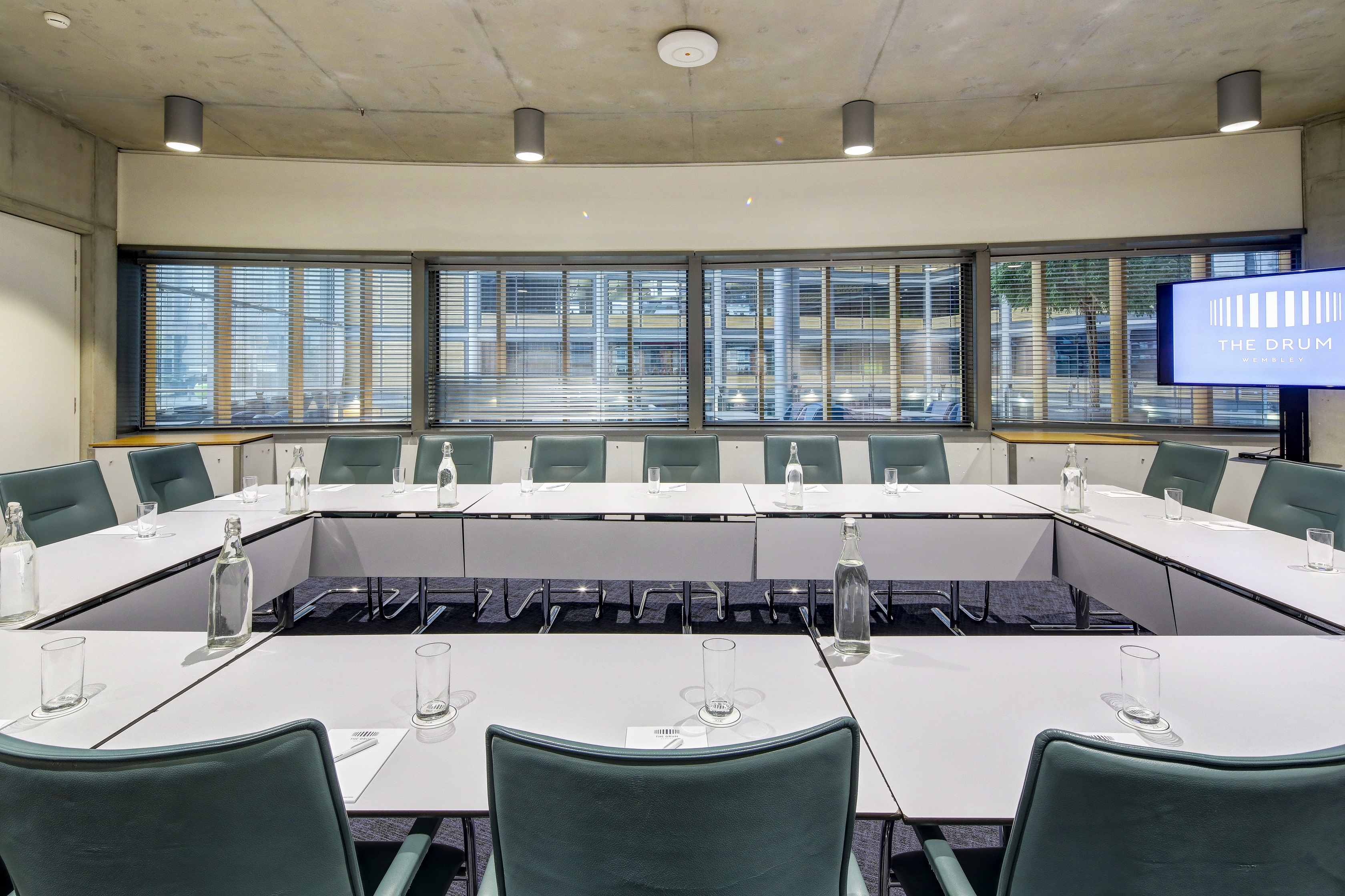 Modern U-shaped boardroom at The Drum, Wembley, ideal for collaborative meetings.