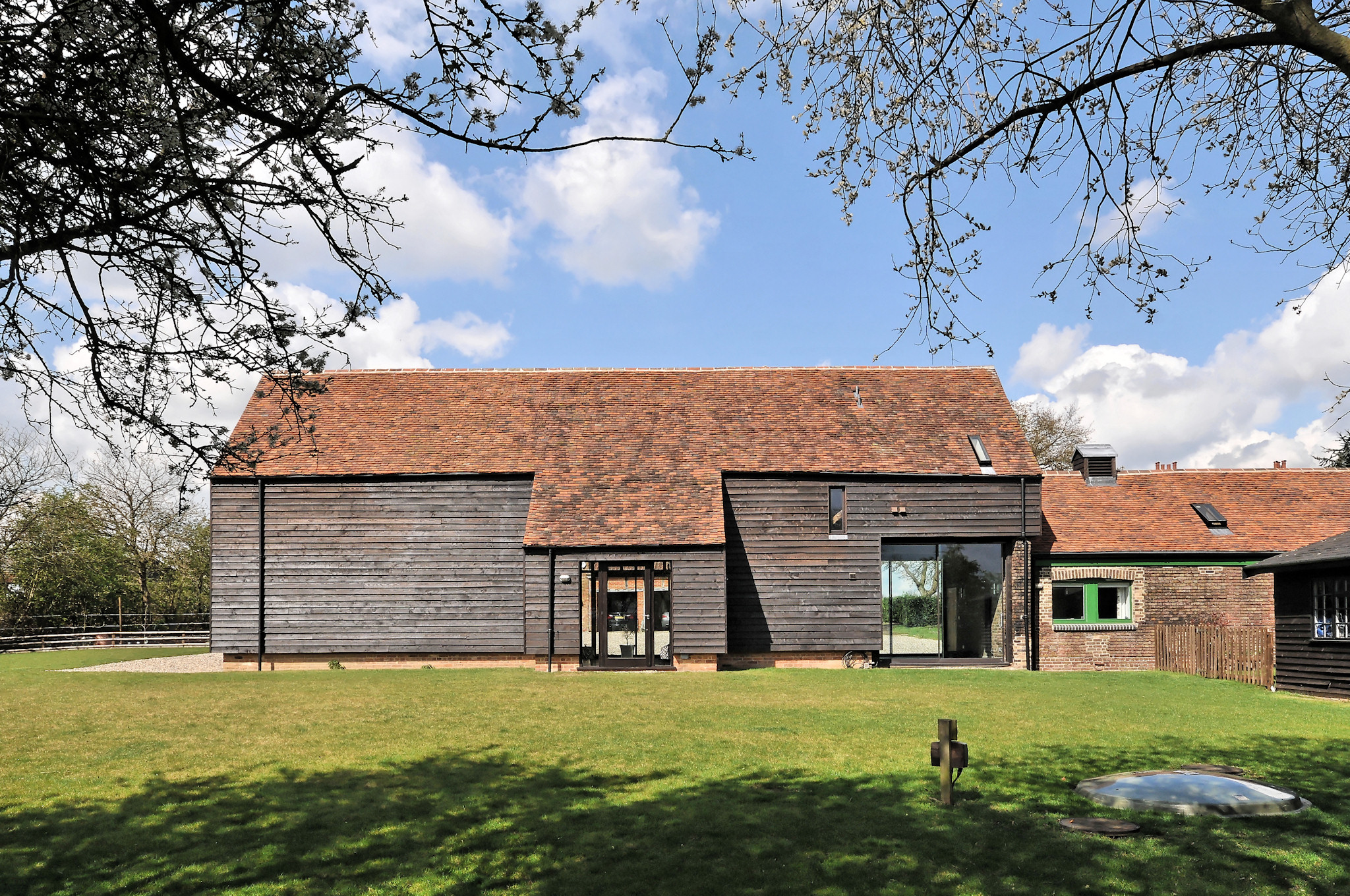 Rustic Rowley Barn venue with wooden exterior, ideal for events and meetings.