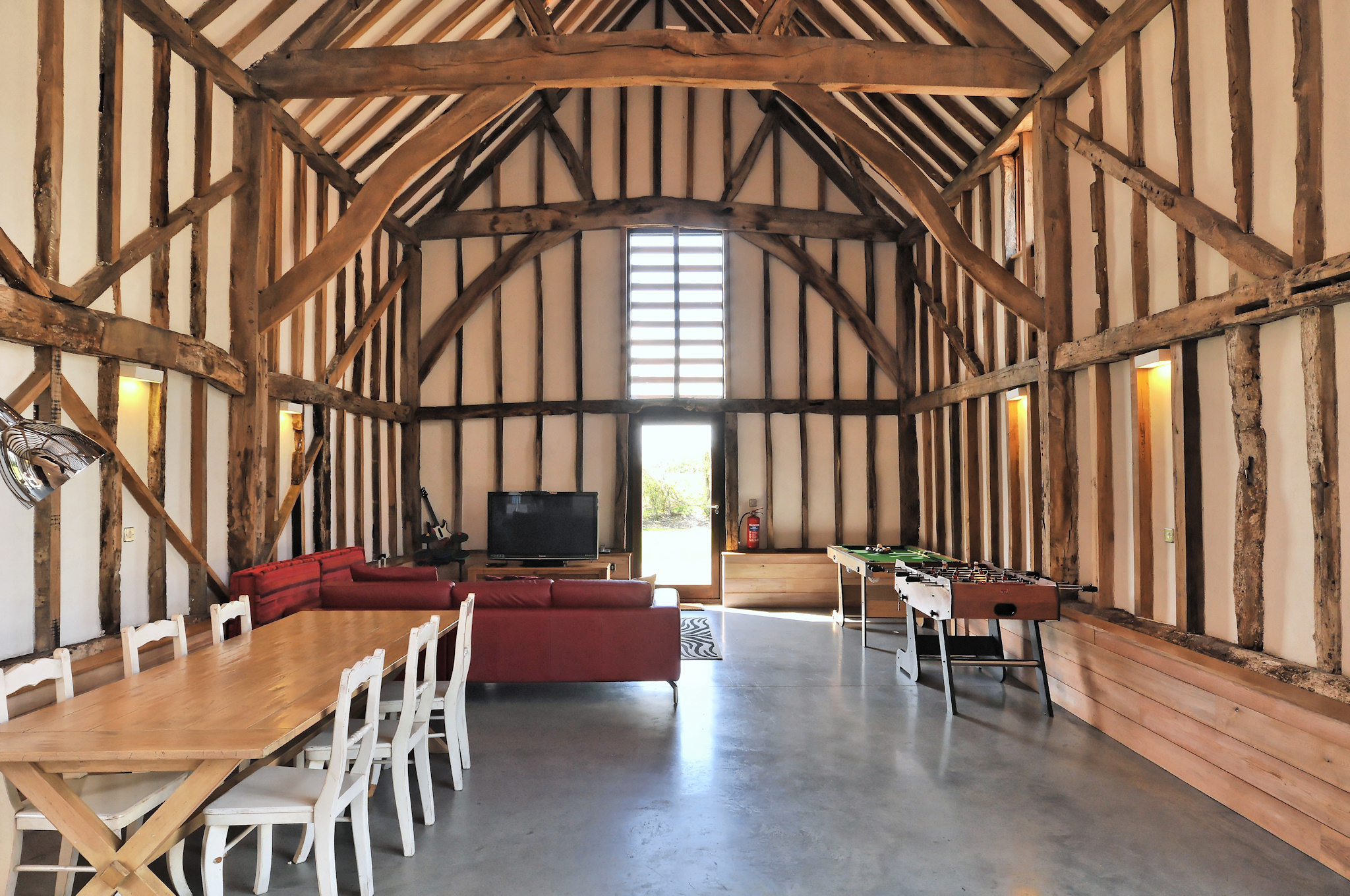 Rustic Rowley Barn venue with high beams, ideal for events and meetings.