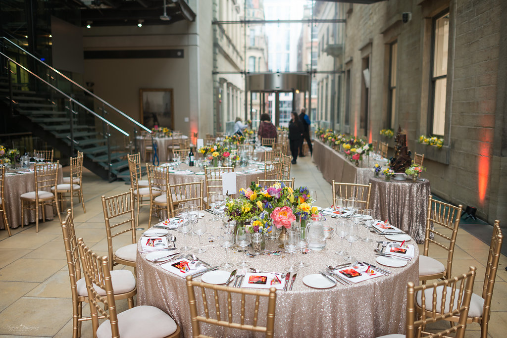 Atrium Manchester Art Gallery with elegant tables and floral centerpieces for events.