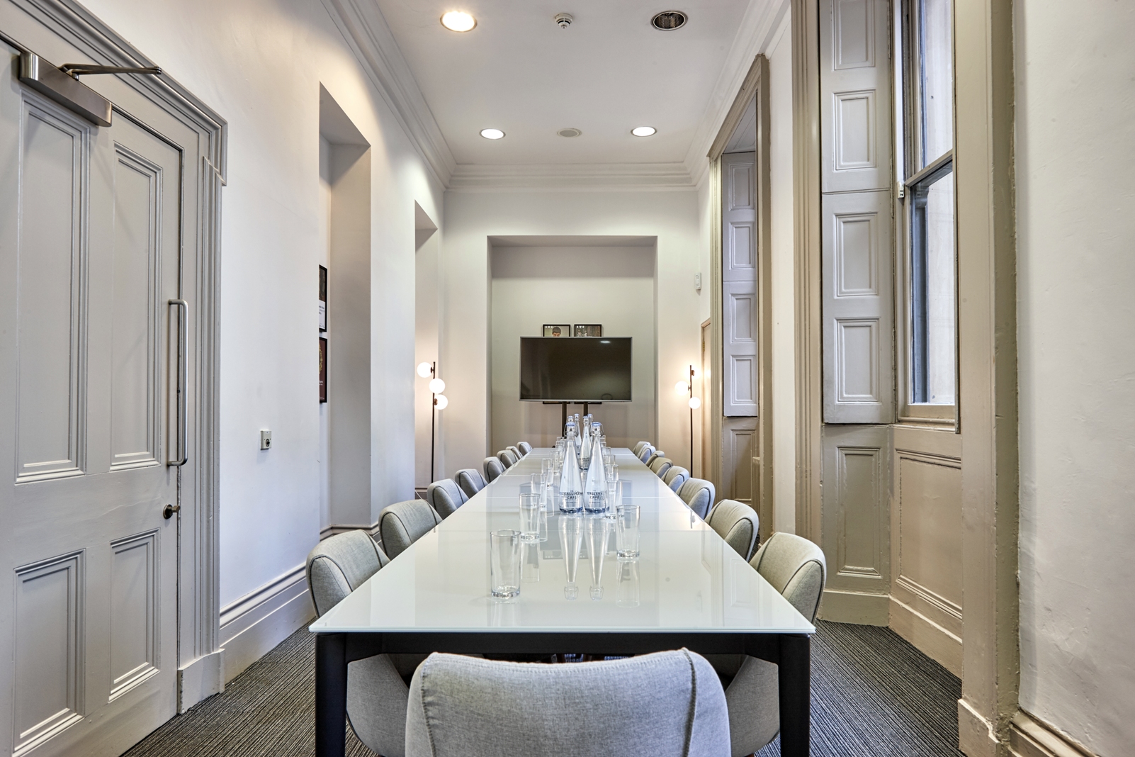 Modern meeting room with long table, ideal for professional gatherings in Manchester.