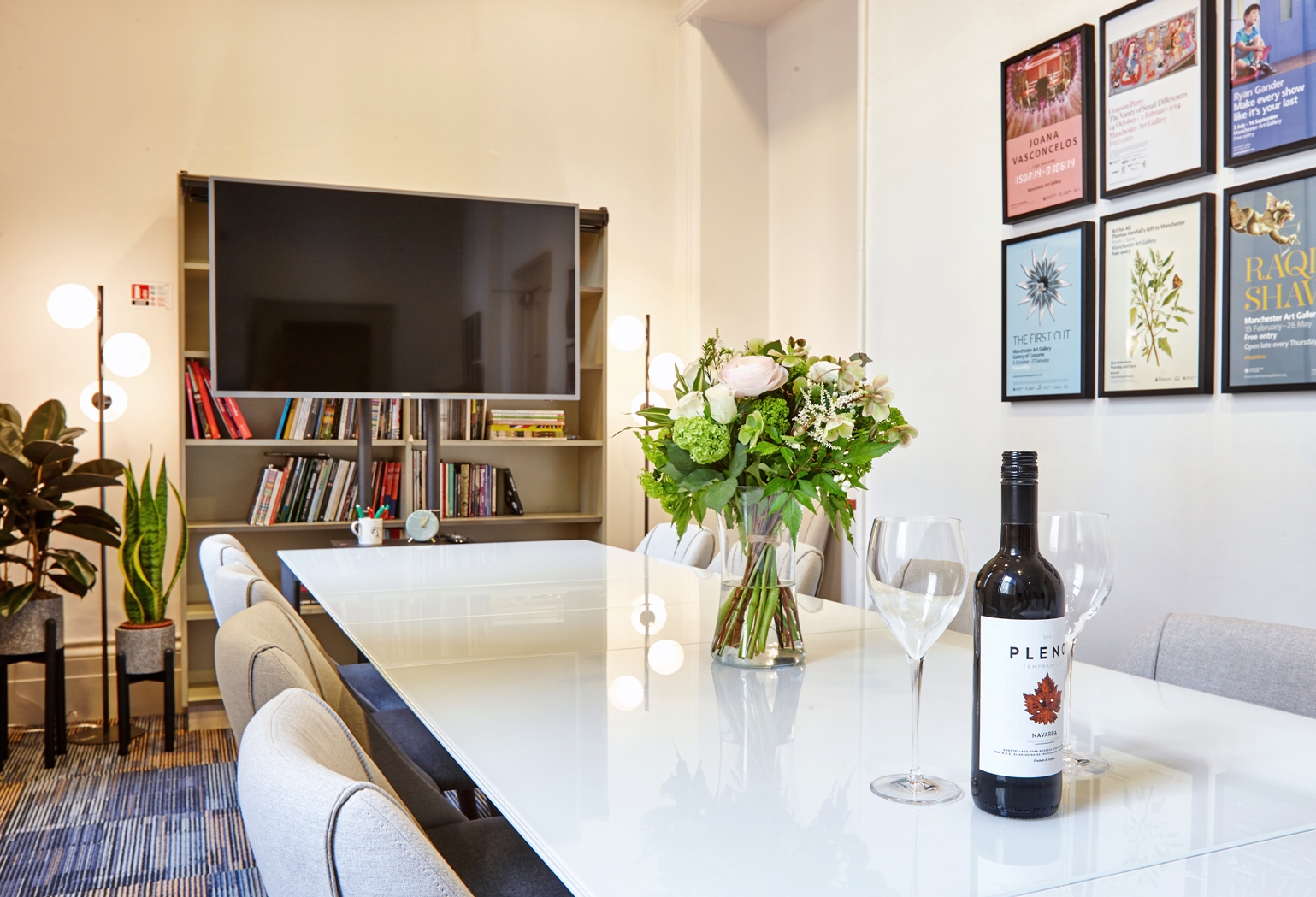 Modern meeting room with glass table, ideal for networking events in Manchester.