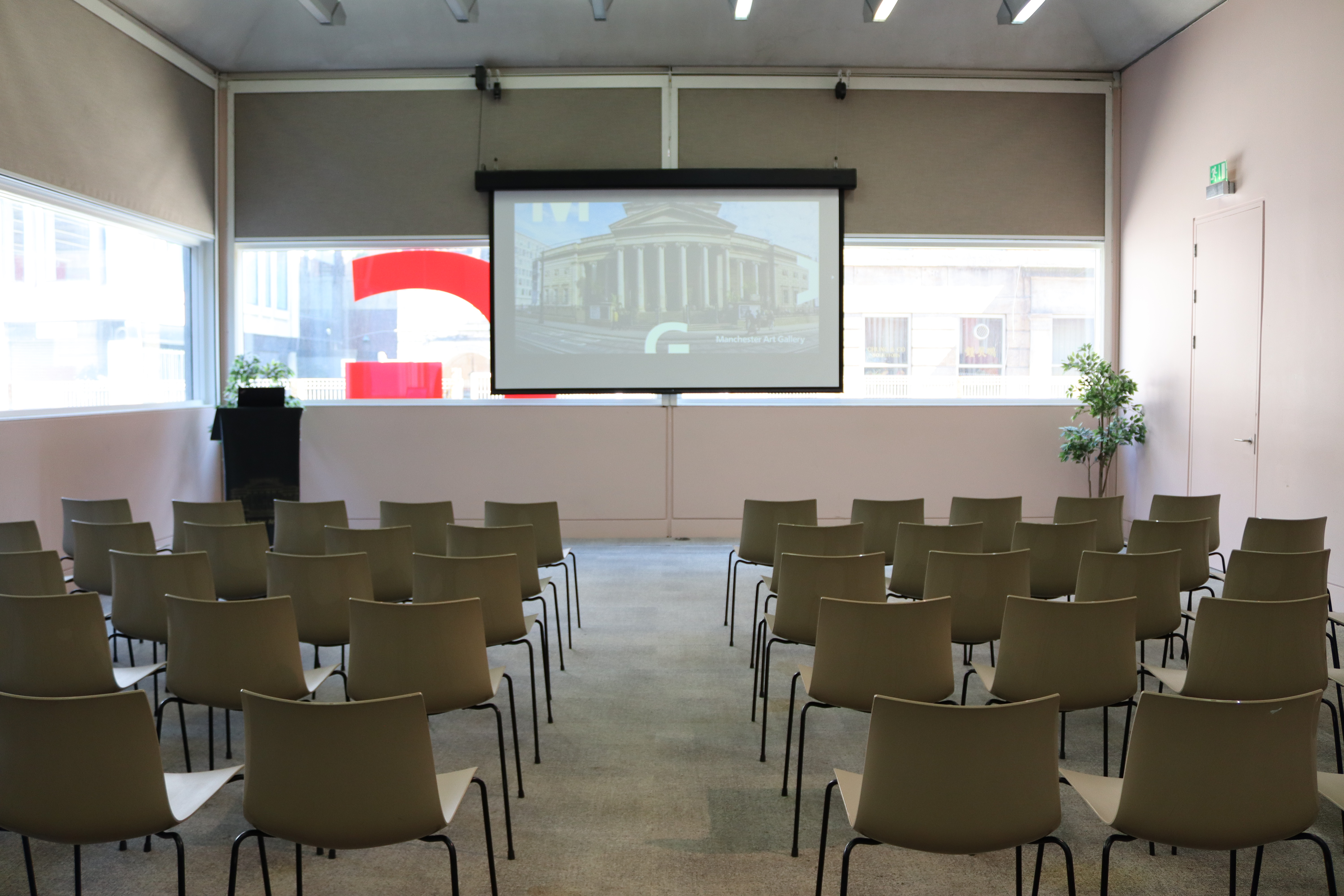 Lecture Room at Manchester Art Gallery, featuring a large screen for corporate events.