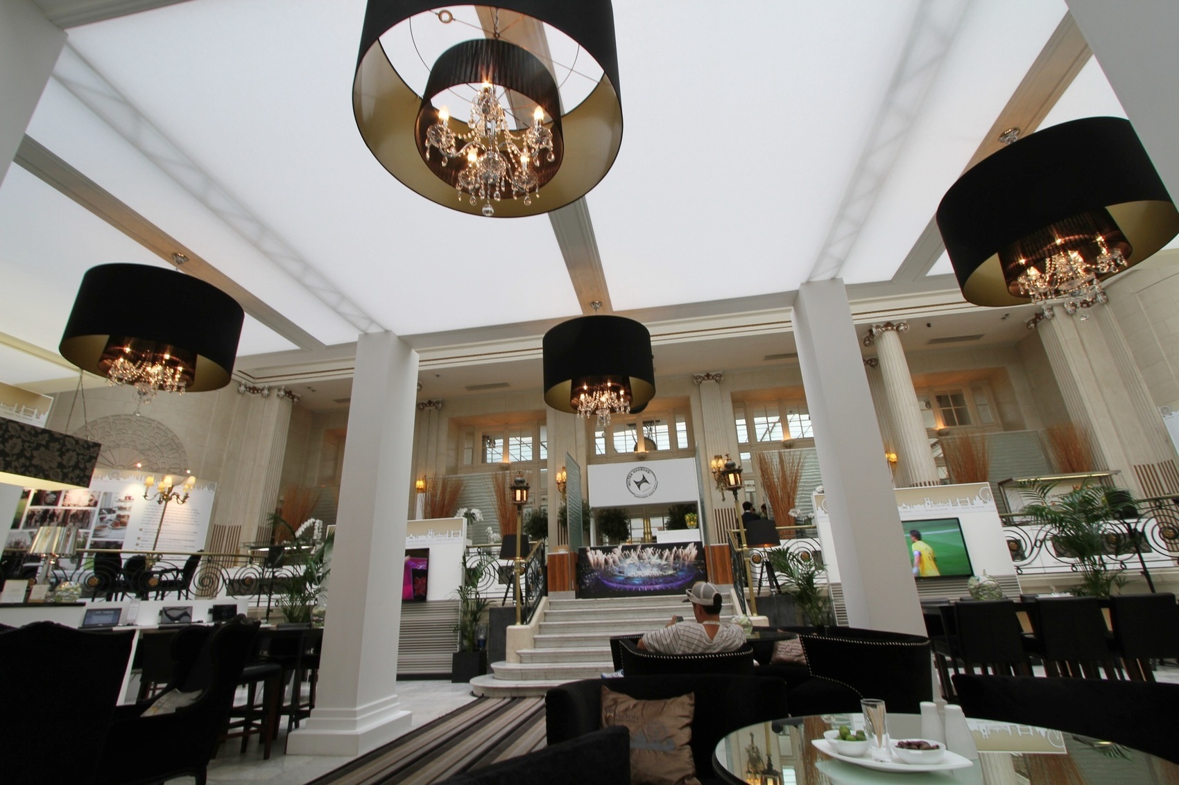 Elegant Palm Court at The Waldorf Hilton, London - upscale event space with chandeliers.