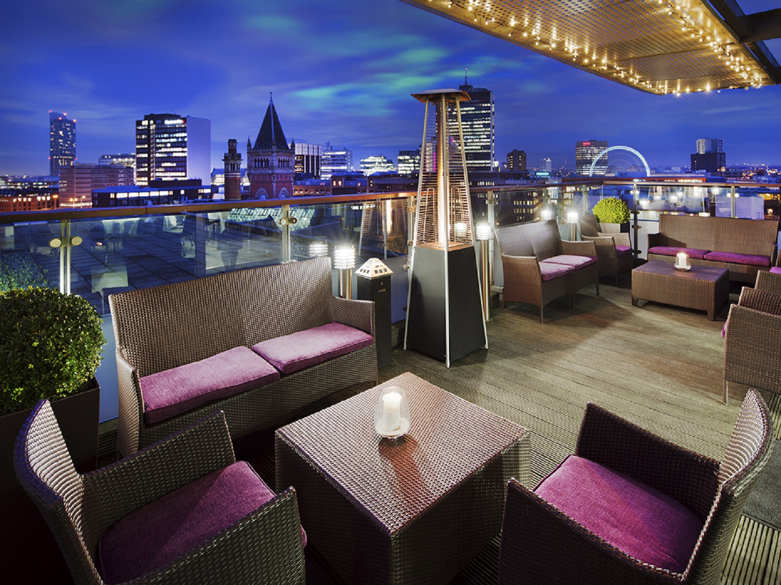 Sky Lounge rooftop venue with city skyline, perfect for upscale events and gatherings.