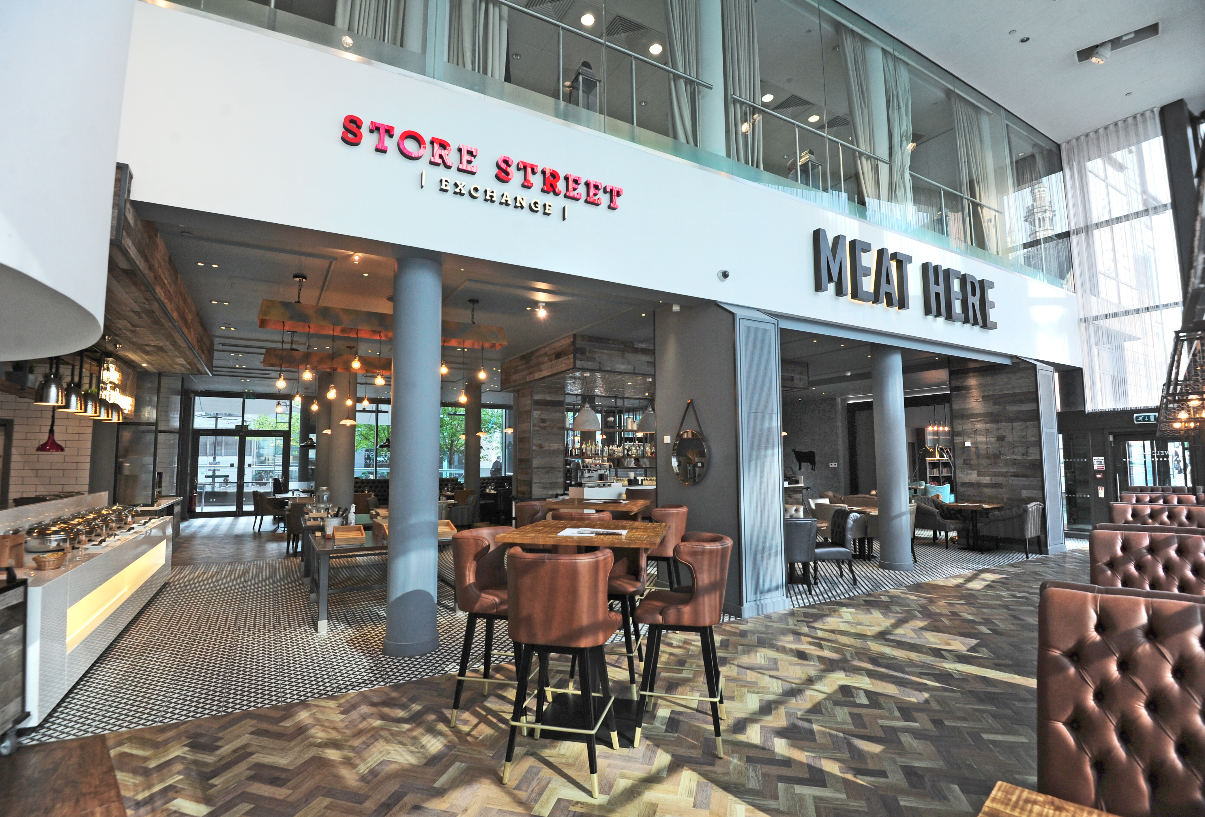 Ground Floor Terrace at DoubleTree Manchester, modern dining space for events and gatherings.