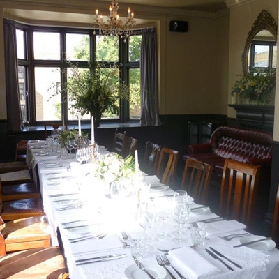 Elegant dining space in The Vine's front garden, ideal for intimate gatherings and events.