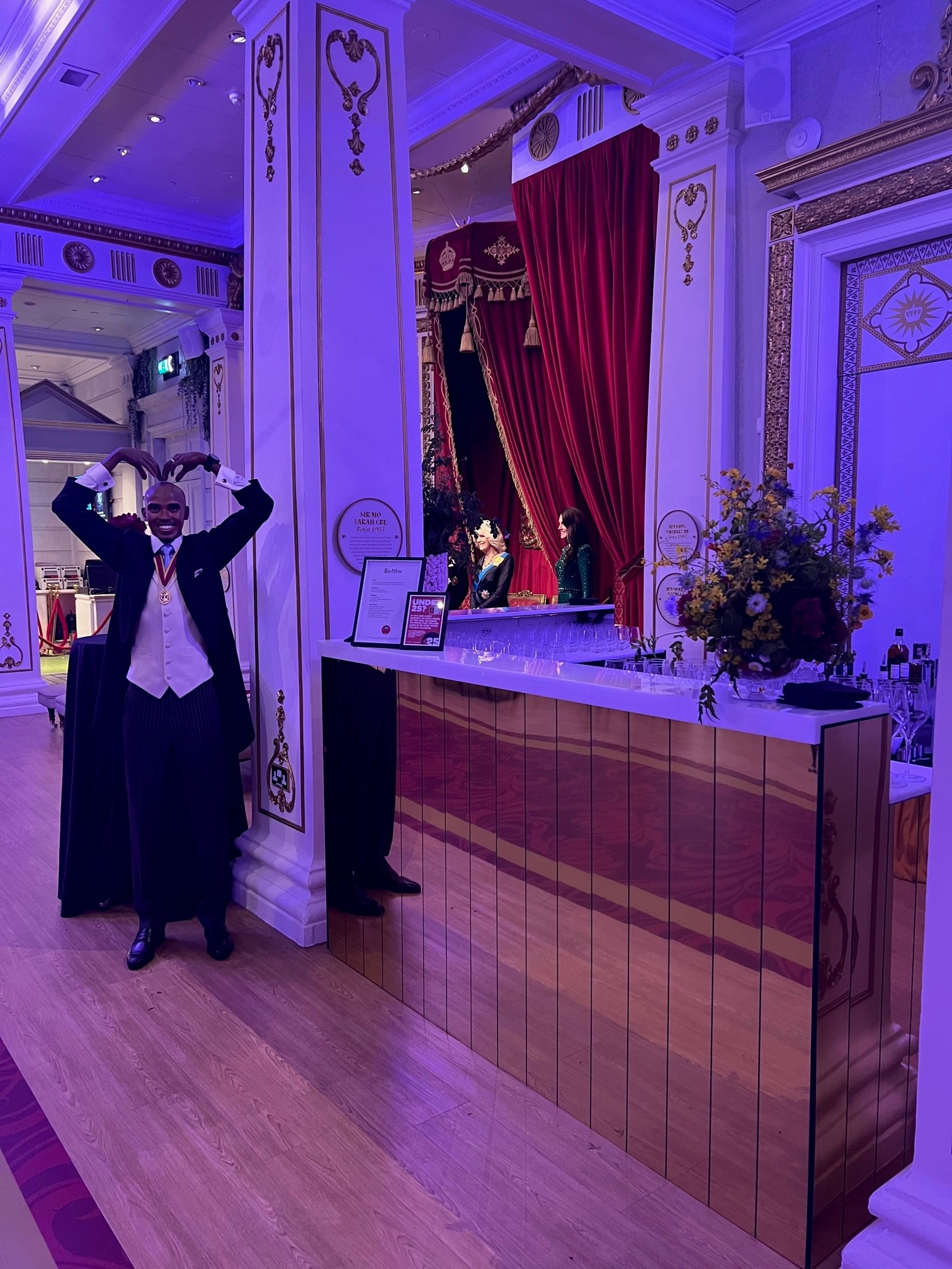 World Stage at Madame Tussauds: elegant event space with stylish bar for networking and celebration.