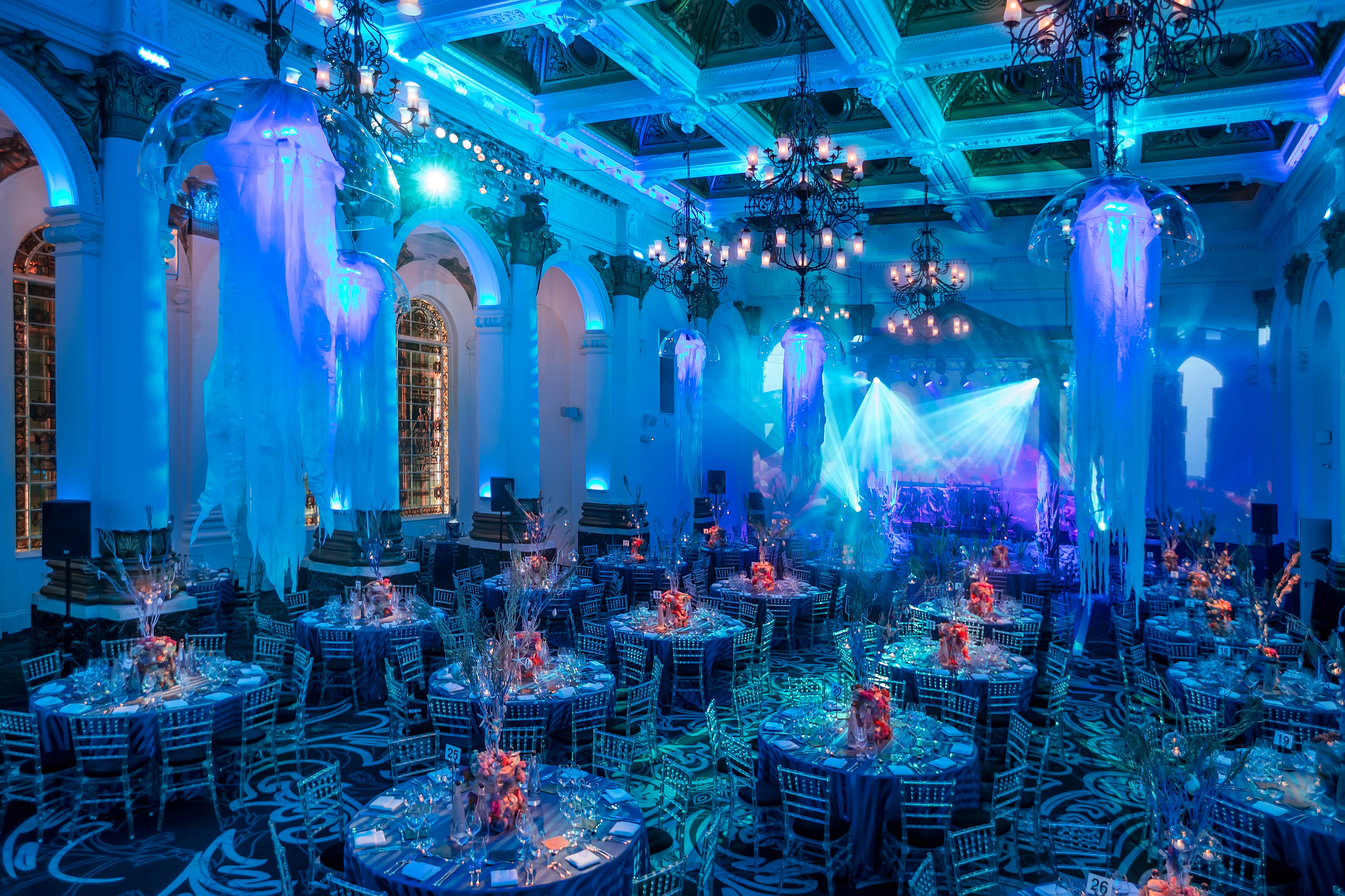 Elegant gala setup in The Ballroom, featuring vibrant centerpieces and ambient lighting.